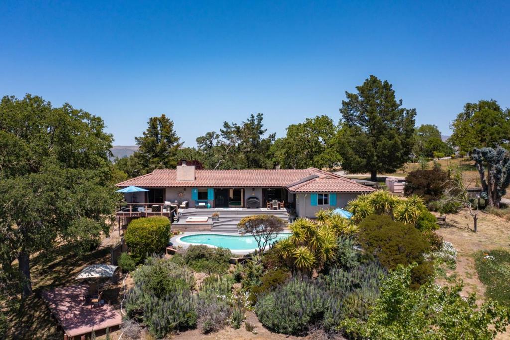 Located just 6 miles from Carmel Village this property is a must see. Experience the perfect blend of privacy, tranquility, and breathtaking views in this meticulously maintained single-level home located in the desirable Sky Ranch Estates. Nestled on a 10-acre property, this exquisite 4-bedroom, 2-bathroom residence has been meticulously maintained and thoughtfully updated. The high ceilings and fireplace create a welcoming ambiance, while the walking closets and air conditioning ensure comfort and convenience. As you approach this remarkable 10-acre property, you'll be welcomed by a park-like setting where the land meets the sky, revealing incredible vistas of the mountains and the Ventana Wilderness. The outdoor space is a true oasis, featuring a refreshing swimming pool and a relaxing spa, perfect for unwinding after a long day. The expansive deck is ideally positioned to capture the sunny southern exposure, providing a perfect spot for entertaining or simply soaking in the views. This property is a must-see for anyone seeking a serene retreat with modern conveniences. Don't miss the opportunity to make this stunning home your own!