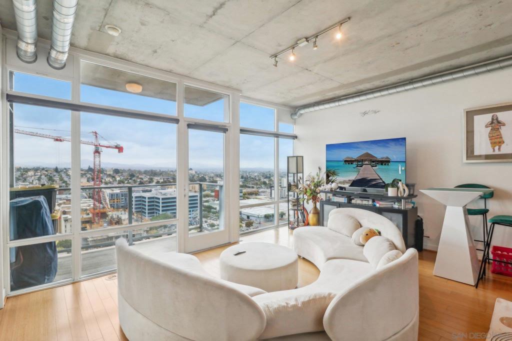 MONTH to MONTH Option Availability! Experience the vibrant heart of San Diego in this beautiful 1 bed & 1 bath East-Facing condo located on the 16th floor at Smart Corner. With its industrial-chic design featuring cement accents, exposed ductwork, sleek upgraded bamboo flooring, and upgraded built closet this sparkling residence radiates an upscale loft vibe. Enjoy sweeping city views and views of Coronado Bridge from your private balcony and take advantage of the open kitchen with ample cabinetry and granite countertops. This high-rise building features a rooftop deck with views of the Bay and Downtown San Diego, you'll find a relaxing Jacuzzi and barbecue area and bike storage areas, along with a newly renovated gym and 24 hour security. Smart Corner has recently upgraded four elevators in the building. You'll also have one assigned parking space in the secure underground lot. Enjoy easy access to freeways and within walking distance to a variety of restaurants, bars, shops, and a supermarket. The airport is just 10 minutes away, and you’ll find Balboa Park nearby for endless fun. Plus, a trolley station is just steps away from your door, making this area a walker's paradise with easy access to Petco Park, the Convention Center and the Gaslamp Quarter. Visit this unit today and enjoy the best of downtown living!