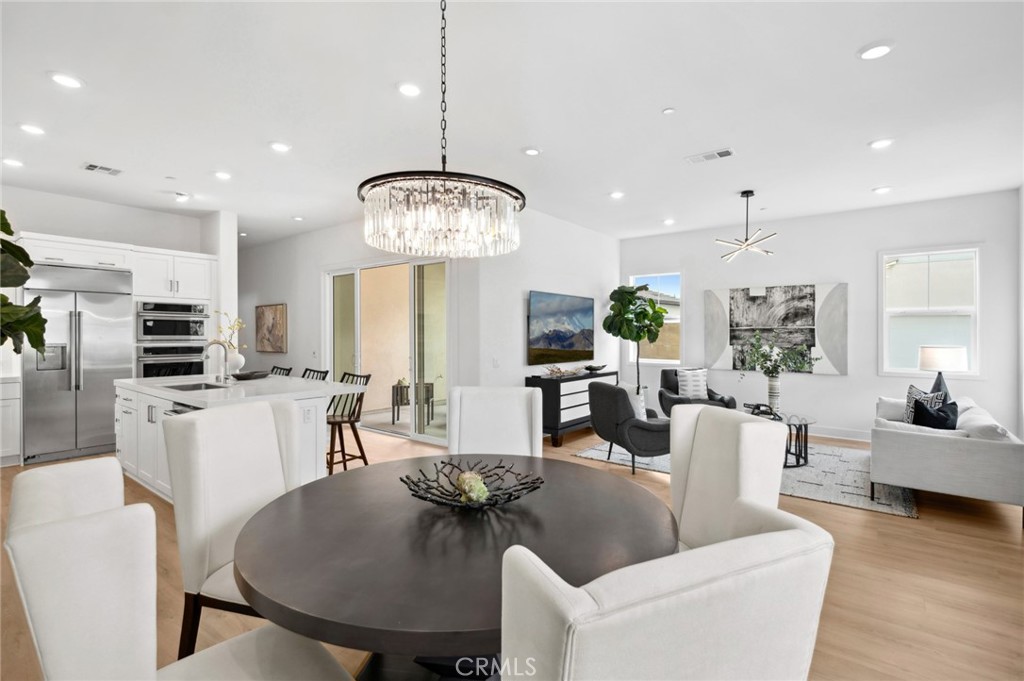 PREMIUM CORNER LOT LOCATION TWO-STORY HOME WITH GREENBELT + HILLSIDE VIEWS JUST STEPS TO PORTOLA HIGH, SOLIS PARK K-8, SOLIS POOLS, THE RETREAT, & SOLIS PARK CLUBHOUSE! Discover modern elegance in the vibrant Solis Park community of Irvine’s Great Park Neighborhoods. This two-story home blends open concept living with private retreats, perfect for families and entertainers. Our Premier “Skylark” Collection Residence THREE at Solis Park was built by Lennar and is a CORNER Lot Premium with NO HOMES DIRECTLY IN FRONT! This FULLY LOADED Contemporary Retreat offers 4BD (one main level) 4BA (one main level), a Loft, Private Deck, and approximately 2,591 Sq. Ft of Decadent Interior Living Space! The home features NEW Luxury Vinyl Plank Flooring, LED Recessed Lighting, Custom Fitted Window Curtains, Shaker Door Cabinets, Solar Panels, and ATTACHED 2-CAR Garage! Chef-Inspired Gourmet Kitchen with Quartz Countertops, Backsplash, Expansive Kitchen Island, White Shaker Door Cabinetry, and ALL Stainless-Steel Appliances (including Built-In Refrigerator)! Private & Quaint Side Yard with Artificial Turf & Private Front Patio. Enjoy world-class amenities exclusive to Great Park residents -- 5 parks, 3 full court basketball courts, tennis courts (25 courts + championship court) 2 junior Olympic pools, 4 spas, 3 club rooms, BBQ picnic destinations at every park and one greenhouse. Award-winning Irvine unified school district (zoned Portola High School & Solis K-8) and just minutes from dining destinations at the Woodbury Shopping Center, Five Points Amphitheater Irvine Spectrum, John Wayne Airport, Kaiser Permanente, and nearby connecting freeways ( I-5, 405, 241, 133, & 73)!