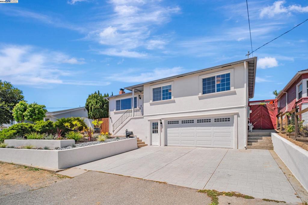 Bright 3 Bedroom, 2 bath home that shows like a model with partial bay views. New designer kitchen cabinets, All New Stainless Steel Appliances and recessed lighting. Nicely front landscaping with auto drip system. Huge area in rear yard for gardening! Central Heat and AIR conditioning. Oversized two car garage. Lowest priced home in the Highly desired Proctor School District! Sewer lateral compliant. MOVE-IN CONDITION!