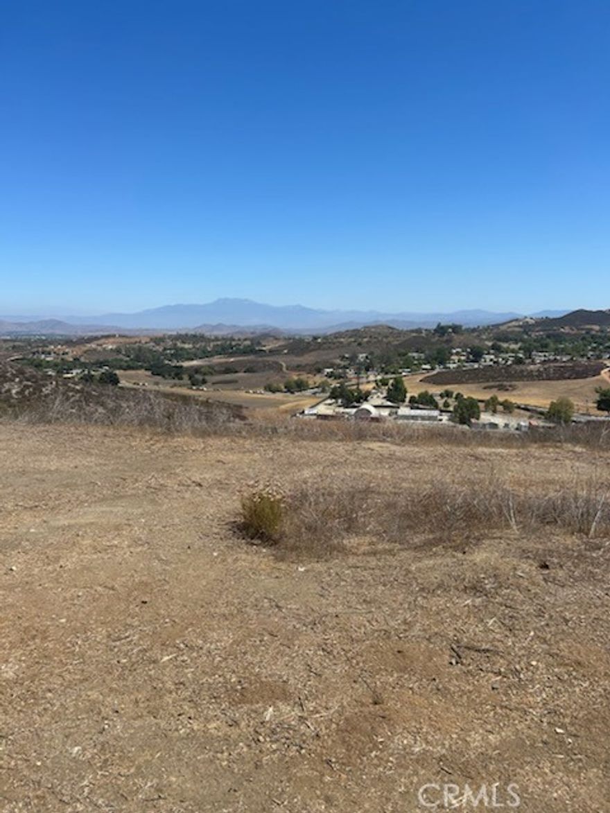 Panoramic Views from this 8.75 acre lot at Bundy Canyon and Chico Hills Road . 2 Pads / flat area's, Over looks the Farm community and valley . Perfect to add a manufactured - modular or stick built home / ADU . In city limits of wildomar . APN 366-310-021. Electric , phone is in the street / cul de sac.