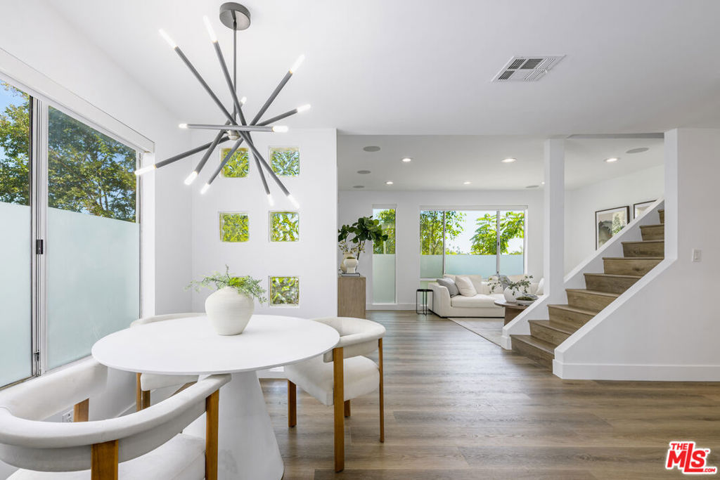 Ideally located in prime Echo Park, this thoughtfully updated townhome-style, 3-story unit offers 3 bedrooms + Office/4th bedroom, 3.5 baths across 1,511 square feet of open living space. With new flooring, high ceilings, and sunlight streaming in from every angle, the home offers comfort and the best of Echo Park living just moments from its best commercial and recreational offerings like Eightfold Coffee, Tsubaki, Eastside Deli, and the trails of Elysian Park. The gorgeous corner unit is located in a rare gated community that offers sweeping and iconic downtown and mountain views and is down the street from quaint Everett Park. The home's front door opens to the main level, where you will find a spacious living area, a brand new kitchen outfitted with stainless steel appliances and ample cabinetry and a large guest bedroom and bath. Your private two-car garage opens to the home's first level and the huge office/gym which doubles as a perfect 4th bedroom. On the 3rd level find 2 huge en-suite bedrooms, including the Primary which has dramatic views of the mountains and Dodger Stadium, a generous walk-in closet and a bathroom with dual vanities and thoughtful finishes. On the top level is the private roof top deck with dazzling 270 degree views where you can lounge and unwind. Perfectly situated in Echo Park's coveted commercial district near Elysian Park, and just minutes to Silver Lake and Downtown, this home offers unbeatable access to Eastside favorites. Whether you're hitting the trails at Elysian Park or strolling to Guisados, you're right where you want to be.