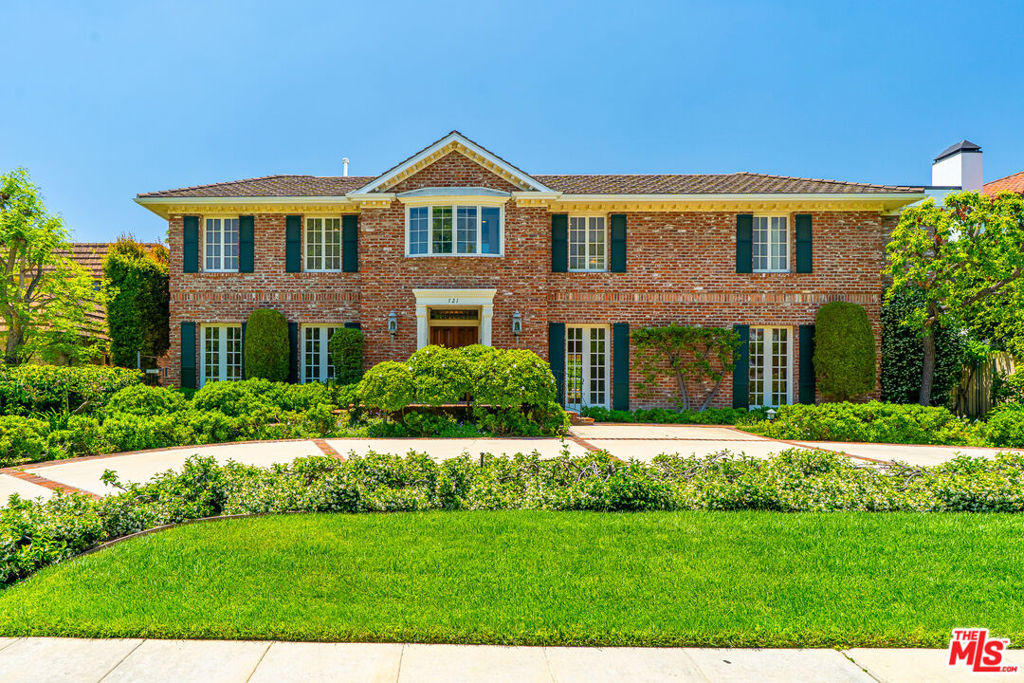 Nestled on a quiet, tree-lined street in the prestigious Beverly Hills Flats, this timeless estate radiates classic elegance and refined charm. Flooded with natural light, the interiors are graced by skylights, vintage details, and sophisticated accents that recall a bygone era of glamour. Set on an expansive, beautifully manicured lot, the residence offers a sprawling grassy yard and enchanting rose garden - an ideal backdrop for both serene mornings and grand entertaining. French doors invite effortless indoor-outdoor living, revealing a covered outdoor kitchen and barbecue pavilion with a cozy fireplace, perfect for year-round gatherings.Beyond its romantic character, the home offers generous living spaces, period architectural touches, and a private, tranquil setting just moments from world-class dining, shopping, and the best of Beverly Hills. Completing this rare offering are a two-car garage and circular motor court with parking for four additional vehicles, as well as a separate guest house perfect for extended stays or private retreats. This estate truly embodies classic Beverly Hills living at its finest.