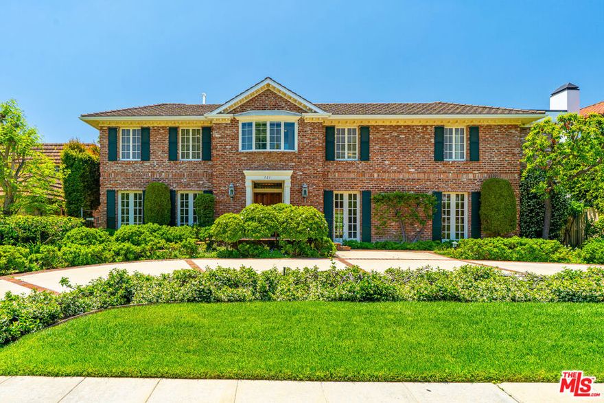 Nestled on a quiet, tree-lined street in the prestigious Beverly Hills Flats, this timeless estate radiates classic elegance and refined charm.  Flooded with natural light, the interiors are graced by skylights, vintage details, and sophisticated accents that recall a bygone era of glamour.  Set on an expansive, beautifully manicured lot, the residence offers a sprawling grassy yard and enchanting rose garden - an ideal backdrop for both serene mornings and grand entertaining. French doors invite effortless indoor-outdoor living, revealing a covered outdoor kitchen and barbecue pavilion with a cozy fireplace, perfect for year-round gatherings.Beyond its romantic character, the home offers generous living spaces, period architectural touches, and a private, tranquil setting just moments from world-class dining, shopping, and the best of Beverly Hills. Completing this rare offering are a two-car garage and circular motor court with parking for four additional vehicles, as well as a separate guest house perfect for extended stays or private retreats. This estate truly embodies classic Beverly Hills living at its finest.