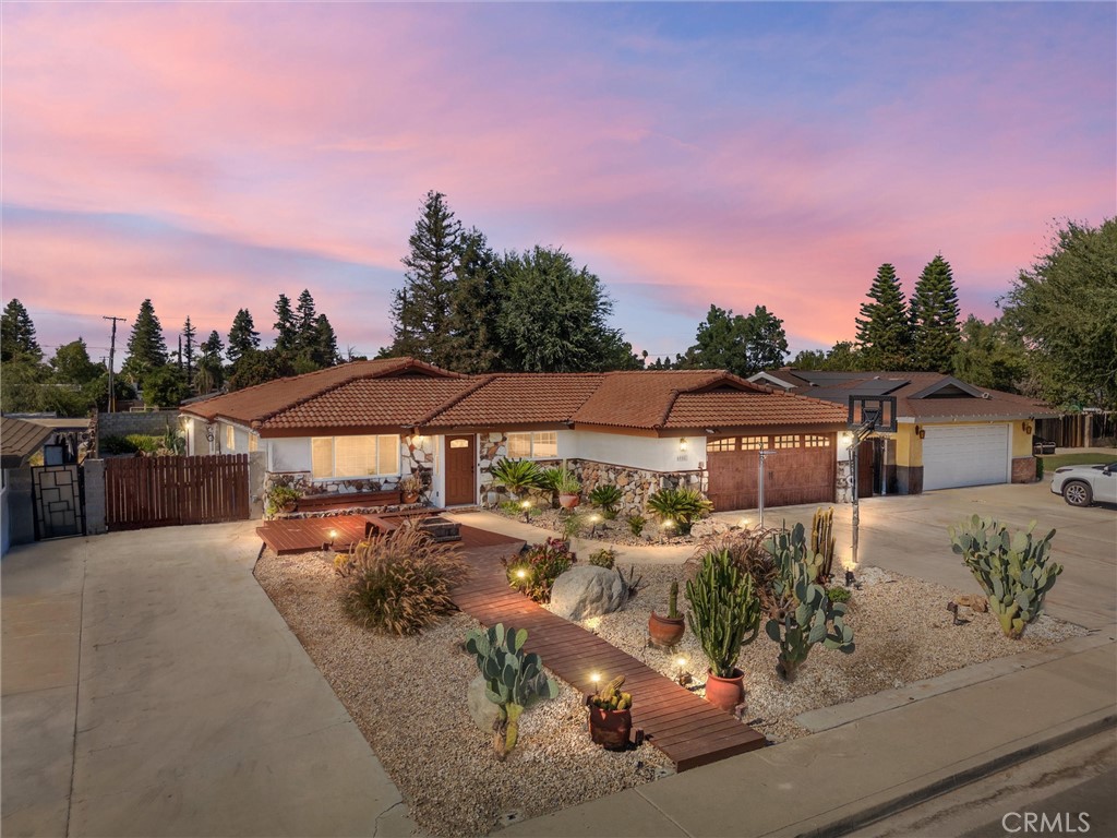 Unicorn property alert, prepare to be impressed! This beautifully updated Olive Estates pool home blends charm, space, and modern upgrades on over a 1/4 acre lot in Northwest Bakersfield. Featuring a tile roof and a spacious layout with 3 bedrooms, 2 bathrooms, a formal living room, separate family room, office, game room addition, and a fun attic play area for kids. Inside, enjoy fresh paint, new wood-look vinyl flooring, upgraded baseboards, recessed lighting, and a tankless water heater. The chef's kitchen boasts granite counters, an island, and stainless appliances. The main bathroom showcases porcelain tile, dual showers, and dual vessel sinks. The backyard is an entertainer's dream with a custom deck entry, built-in fire pit, heated replastered spa and pool, and a built-in BBQ area. RV parking fits multiple vehicles and includes a charging outlet. This rare Olive Estates gem offers both comfort and lifestyle, truly a must-see!