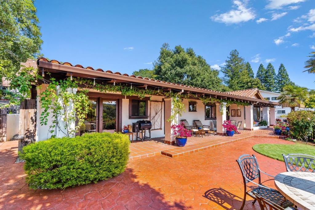 Welcome to 102 Pasatiempo Drive, an exceptional Spanish-style villa nestled in the prestigious Pasatiempo Golf Community, one of Santa Cruzs most sought-after neighborhoods. This rare home blends timeless architectural elegance with modern comfort, offering a lifestyle surrounded by nature, privacy, and proximity to top amenities. From hand-carved accents, colorful tilework, and a classic stucco fireplace, every detail reflects warm, Mediterranean-inspired design. Inside, enjoy light-filled living spaces, wood-beamed ceilings, and seamless indoor-outdoor flowperfect for entertaining or relaxing. The home features three bedrooms, a bright kitchen with premium appliances and abundant natural light, plus updated bathrooms throughout. French doors open to tranquil courtyards and landscaped patios, ideal for embracing Santa Cruz coastal living. Enjoy partial golf course views and a stunning backdrop of Redwoods from nearby Henry Cowell State Park. Located just minutes from top-rated schools, hiking and mountain biking trails, Downtown Santa Cruz, Highway 17, and the Monterey Bay, this gated golf community is also home to the iconic Alister MacKenzie-designed course. Two restaurants MacKenzie's Clubhouse and The Hollins House, both wonderful choices for casual and upscale fare.