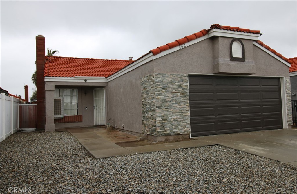 Great 2 Bed/2 Bath home for rent in Perris. Tile & Vinyl Plank Flooring throughout entire home - no carpet! Vaulted ceilings in the Family Room & Kitchen. Master Ensuite has a full-length closet, and a Shower/Tub combo. Off the Master Bedroom is an Enclosed Patio providing extra space for family to play or relax. The Second Bedroom is larger than normal. 2 Car enclosed garage with access to interior of home. Easy care yard with no landscape to maintain. Sorry, NO PETS allowed.