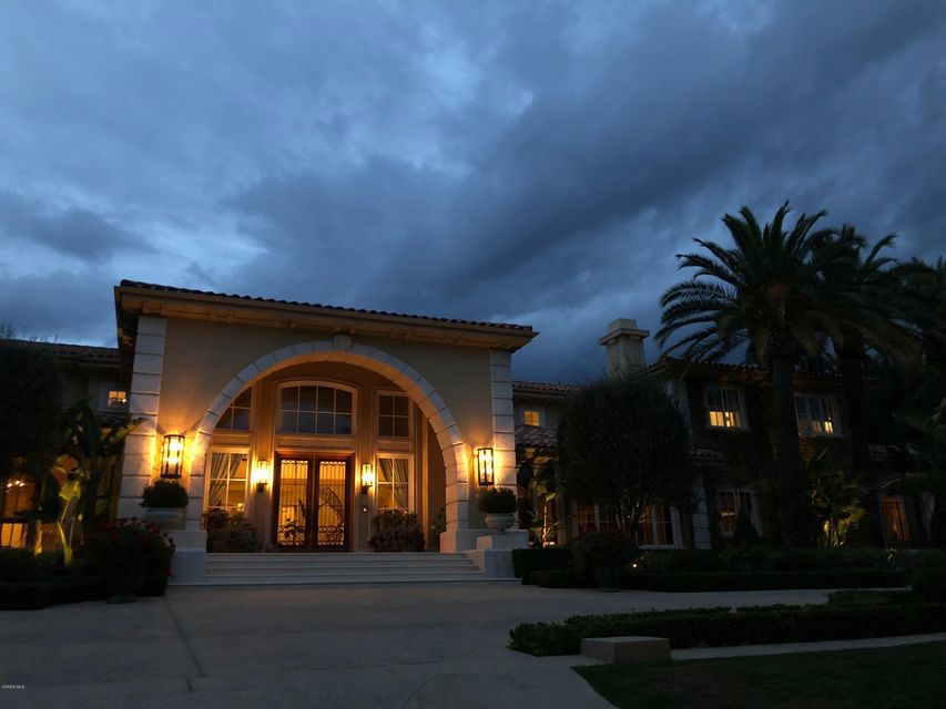Grandeur is revealed within this luxury estate. The brilliant, architecturally impressive entry is one of a kind, featuring a spectacular arch that signifies the poise of what is to be divulged behind its handsome front doors. Indulge in elegance with the gorgeous double staircase, accented with the highest of ceilings & most impeccable details. A few of the finest features include a state of the art kitchen, home theater, luxurious formal dining & remarkable fitness facility. The gorgeous interiors are only the first view of perfection; upon gracing the backyard, enjoy the sprawling grounds, presenting stylish dining accommodations. The quality of this home is founded on its sophisticated, refined beauty & ability to accomplish a feeling of comfort among such grand uniqueness.