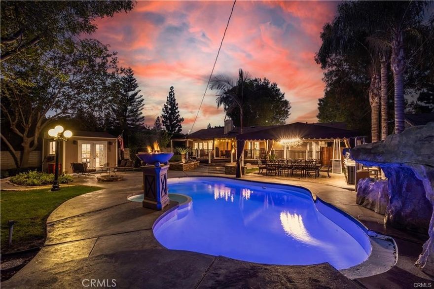 SPLENDID ENTERTAINING ESTATE IN NORTHRIDGE! 3 Beds + 3 Baths Appox 2,200 SqFt of living space, fully furnished & sits on a huge 16,000 SqFt Lot. As you enter, you're greeted with a spectacular open floor plan with chandeliers all throughout, a formal dining and living room, tons of natural sunlight entering through the French doors, & new flooring and custom crown moldings. The gourmet kitchen is fully equipped with stainless steel appliances, double ovens, granite countertops, back splash, lots of cabinet space. Located off the kitchen is the spacious butler's pantry/laundry area and full bathroom. The garage has been converted to a bonus room that could serve as a 4th Bedroom or family room. Down the hall is the master bedroom that offers its own private bathroom, 2 other good-sized bedrooms with one that offers French doors leading to the patio, a full bathroom with a door leading to the patio, and a walk-in closet. The entertainer's backyard has a sparkling pool & spa with a waterfall and fire bowls, patio covering the outdoor kitchen and dining table, a fire pit with seating, a second custom built kitchen with its own stove top, fridge and sink. Perfect to entertain everyone all year round!! The spacious circular driveway has room to fit all your cars & toys! This home truly has it all, sophisticated, well designed for the whole family. A true paradise! Conveniently located close to the 118 freeway, shopping, The Vineyards, CSUN, & so much more. Welcome home!