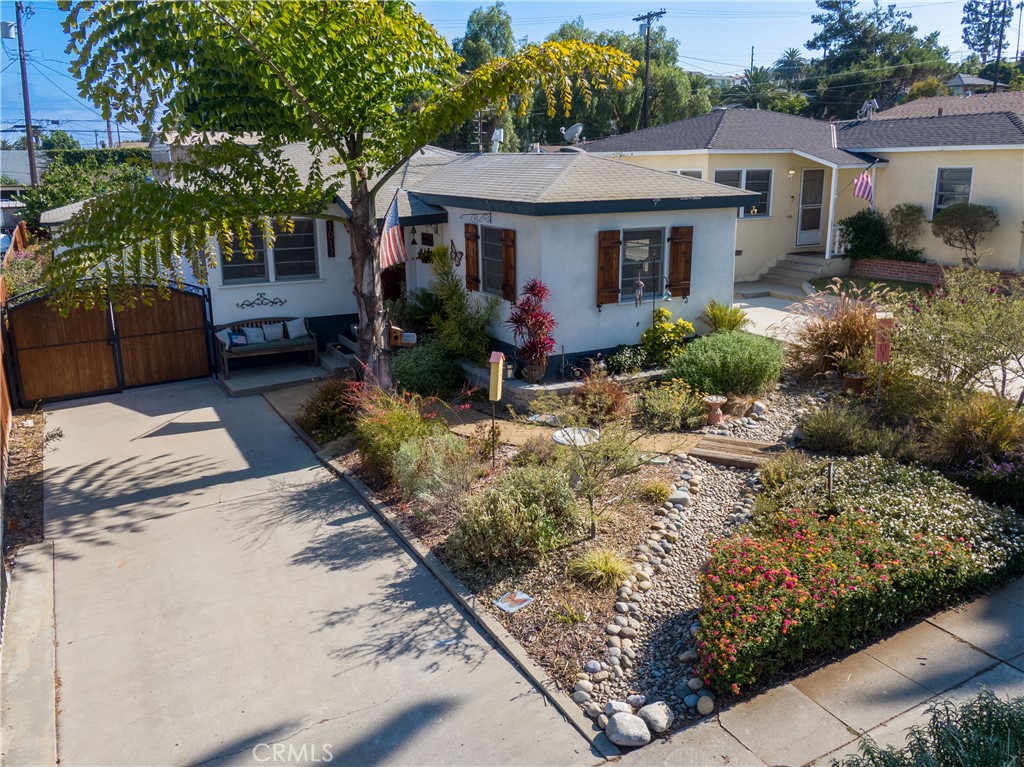 This delightful 2-bedroom, 1-bathroom home features hardwood floors, a recently remodeled bathroom, and over 1,000 square feet of comfortable living space. A whole house fan helps keep the home cool and energy-efficient. Sitting on a spacious 6,000+ SF lot, the property offers endless potential.
The detached 2-car garage provides excellent storage or the opportunity for future expansion.
You’ll love the curb appeal, complete with a beautiful drought-tolerant front yard, a thriving garden, and new wood fencing. The indoor laundry area is conveniently located just off the kitchen, and the generous backyard is perfect for entertaining, relaxing, or growing your dream garden.
Located just moments from San Pedro’s vibrant Arts District—home to galleries, studios, and the popular First Thursday Art Walk—this coastal charmer blends historic character with modern updates. Plus, it’s ideally situated near the highly anticipated West Harbor, a vibrant new waterfront destination opening soon with shopping, dining, entertainment, and other exciting waterside experiences.
With its unbeatable location, spacious lot, and versatile layout, this San Pedro gem is a rare find with so much to offer!