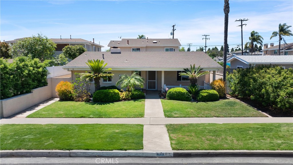 Enjoy coastal living in this beautifully maintained single level home in a prime Huntington Beach neighborhood just minutes from the ocean.
This bright, three bedroom, two bath home, features an open layout with spacious living and dining areas, skylight, plantation shutters, dual ceiling fans, and a cozy river rock fireplace. Tile floors run throughout. The kitchen offers custom cabinetry, tile countertops, recessed lighting, gas cooktop, and stainless steel appliances.
Updated bathrooms include a spa style stone tile shower and a glass enclosed tub/shower. A separate laundry room adds convenience and access to the side yard.
The private backyard includes patio space, lawn, and a shade structure -perfect for relaxing or entertaining- and provides access to a detached two car garage. A large front porch and lush landscaping complete the inviting curb appeal.