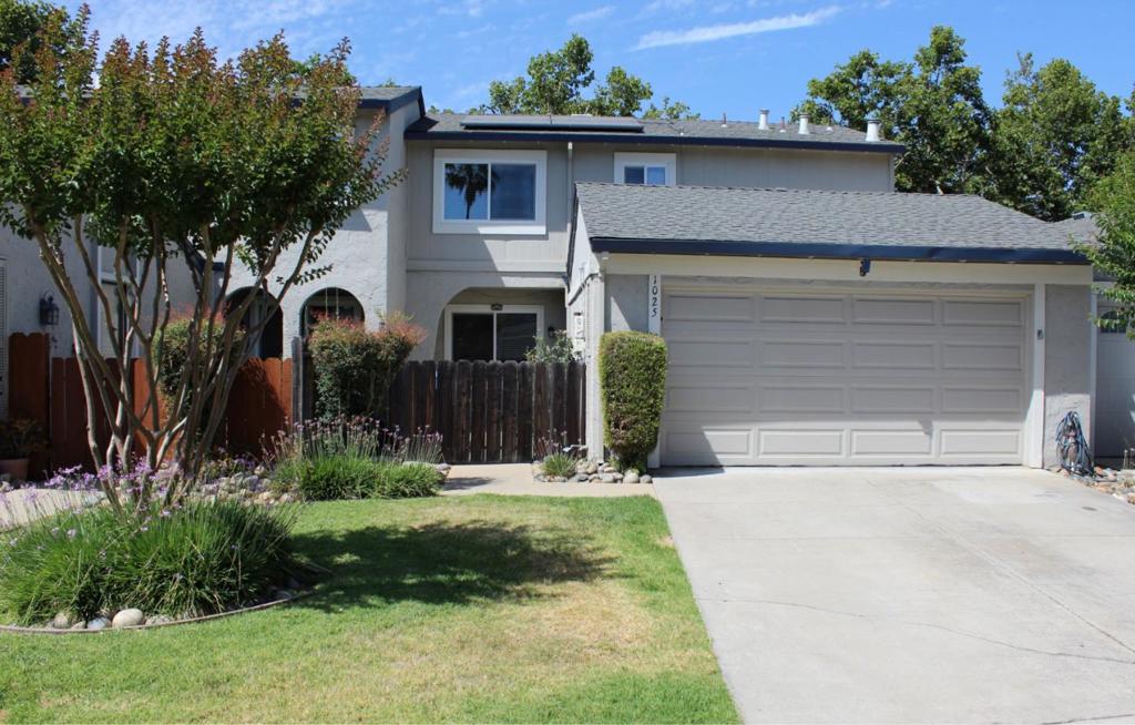Welcome to this charming home located in the vibrant city of Gilroy. This 1,620 sq ft townhouse condominium offers a spacious and functional layout with 3 bedrooms and 2 full bathrooms upstairs and a half bathroom downstairs. The kitchen is equipped with an electric cooktop, granite countertops, dishwasher, garbage disposal, microwave, and refrigerator. The sliding glass door in the kitchen leads to a spacious backyard and patio. The home features laminate and tile flooring throughout, providing an easy-to-maintain surface. The cozy fireplace adds warmth and ambiance, perfect for relaxing and gatherings. The laundry area is situated off the kitchen, stack washer and dryer included. The home is also designed with energy-efficient double-pane windows and offers central AC and heating, supplemented by solar energy. In addition to the attached 2-car garage, there is an assigned parking space in the common area. Residents can enjoy a variety of amenities, including a clubhouse, a refreshing swimming pool, and a game court, all within a secure, fenced area. This property is within the Gilroy Unified School District and close to shopping and other amenities.