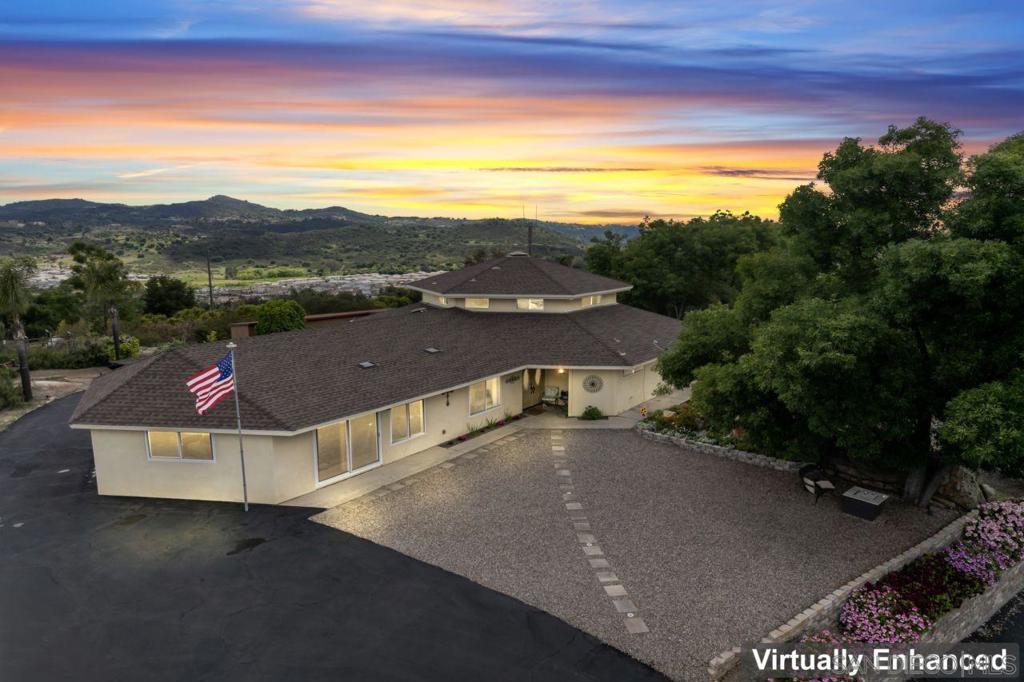 This hilltop haven is priced to sell and ready for its next chapter. Imagine waking up every morning to breathtaking, 360-degree views of Mt. San Jacinto, Palomar Mountain, and peaceful, rolling hills as far as the eye can see.This four-bedroom, three-and-a-half bath, 3,428 square foot Valley Center retreat sits atop a private hill and offers the perfect mix of quiet country living and modern comfort—with no HOA to worry about. Situated just 20 minutes from Escondido’s vibrant and up-and-coming Grand Avenue district, this location blends peaceful living with easy access to dining, shopping, and entertainment. Inside, you’ll love the nicely updated, sun-drenched open floor plan, vaulted ceilings, energy-efficient upgrades, and a spacious kitchen built for the home chef—with generous cabinetry and a natural flow. Upstairs, a bonus suite with full private bath is perfect for guests, a home office, or your own creative space. Downstairs, the primary suite features a walk-in closet and a private, updated bath. You’ll also find two additional large bedrooms, a full hall bath, and a convenient half bath. Step outside to wide open possibilities: a detached workshop ideal for woodworking, auto projects, or extra storage. The property also offers producing fruit trees and expansive land ready for your vision—whether it’s an ADU, vineyard, pool, or private sanctuary. With space to roam, room to grow, and views that steal the show, this home is a rare find. Don’t miss your chance to make this house your home. Hilltop Sanctuary with Endless Views and True Country Living Welcome to your dream retreat—perched high atop a private hill with unmatched 360-degree mountain and valley views from every window. This 4-bedroom, 3-bathroom 3428 sqft estate offers a rare blend of privacy, comfort, and flexibility, set on a spacious lot in one of Valley Center’s most coveted, rural-feel neighborhoods. Inside, you’ll love the inviting open-concept layout designed to soak in the natural light and scenery. Multiple living areas invite gatherings or peaceful reflection, while the expansive kitchen provides a seamless flow for entertaining. Step outside to discover multiple serene sitting areas, ideal for watching the sunrise, sunset, or stargazing under the clear night sky. Hobbyists and creatives will appreciate the large detached workshop—perfect for woodworking, automotive projects, or storage. The land features a variety of well established fruit trees and berries, adding both charm and sustainability to this unique property. The Neighborhood: Set in a well-established, tight-knit community with spacious 2-acre+ lots, every home here is as unique as the people who live in them. You'll experience true country living with modern conveniences, where original owners still call it home. Outdoor Adventures & Amenities: Nature lovers will thrive with over a dozen nearby hiking trails, including Hellhole Canyon Preserve and Palomar Mountain. Enjoy camping, fishing at Lake Wohlford or Lake Henshaw, and year-round community events at the beloved Bates Nut Farm, known for car shows, music festivals, and holiday celebrations. Local Favorites & Entertainment: Grab a bite at Fat Ivor’s Rib Rack or the local favorite Country Junction Deli, or head 12 minutes down the road to Harrah’s Resort & Casino for upscale dining, live entertainment, and more—including Gordon Ramsay’s Hell’s Kitchen. Family-Friendly & Convenient: Families will appreciate the proximity to Valley Center schools—all within 5 miles, and plenty of parks and youth sports programs throughout the area. With multiple routes to freeway access, commuting is simple while maintaining the peace and privacy of your hilltop haven.