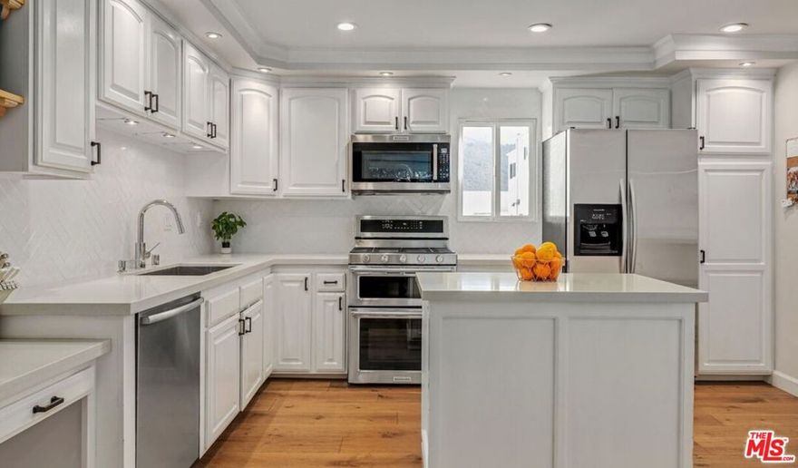 Beautifully remodeled townhouse located in The Highlands in Pacific Palisades. It features 3 bedrooms, 3 bathrooms and an open floor plan with wide-plank engineered hardwood floors throughout. The living room has a fireplace, high ceiling, and a large enclosed patio. The spacious open kitchen has quartz countertops, an island and breakfast bar with pass through to the Dining Area. There is room off the kitchen that can be used as a den, office or 3rd bedroom. The primary bedroom has an ensuite bathroom, walk-in closet and attached room that makes the perfect home office. The 2nd bedroom has a full ensuite bathroom. There is a private 2-car garage with direct entry, newer HVAC with Nest control. With an abundance of HOA amenities including tennis courts, swimming pool, spa, gym, sauna, and guest parking, this property truly offers it all. Owner pays for water and HOA dues.