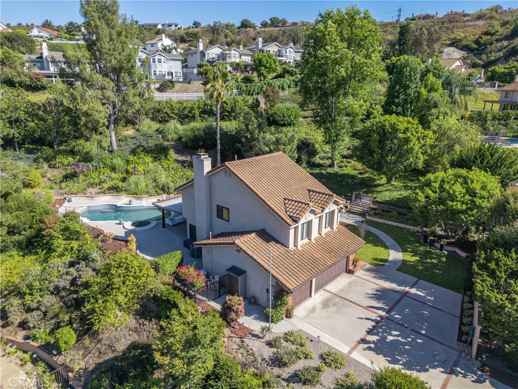 **Dreamy Escape in Anaheim Hills – Your Oasis Awaits!**
Welcome to your slice of paradise nestled in the heart of Anaheim Hills, CA! This stunning 4-bedroom, 2.5-bathroom residence boasts a generous 2,039 square feet of exquisitely designed living space, set on an expansive 21,875-square-foot lot.
As you approach this beautiful home via the private driveway lined with flourishing landscapes, you’ll instantly feel a sense of tranquility wash over you. Step inside and be greeted by warm wood floors that create an inviting ambiance throughout. The thoughtfully remodeled bathrooms offer modern elegance while maintaining a touch of cozy charm.
The heart of this home is undoubtedly its sprawling backyard a true sanctuary for relaxation and entertainment! Imagine spending lazy afternoons lounging on the twin size swing by the glistening newly refinished pebble pool or hosting gatherings under the newly built custom patio cover surrounded by mature trees that add character and serenity to your outdoor experience. Whether it’s family barbecues or quiet evenings stargazing or enjoying the views of snow covered mountain in winter with a hot cup of joe in hand or perhaps soaking up the summer sun, this backyard provides endless opportunities for enjoyment.
Each bedroom is generously sized providing comfort and privacy for everyone in the family—perfectly blending thoughtful design with modern amenities. The open-concept living area seamlessly connects to beautiful upgraded kitchen equipped with newer stainless-steel appliances, making it an ideal space for both casual meals and festive celebrations. Natural light floods the interiors, enhancing the warm and inviting atmosphere throughout the home. With ample storage and stylish finishes, every corner is designed to cater to your family's needs while maintaining a sense of elegance and comfort. This home truly embodies the perfect balance of functionality and charm, making it a haven for cherished memories.