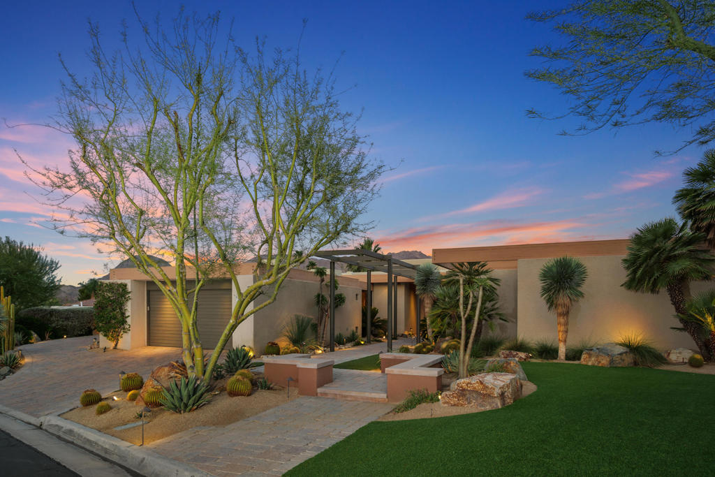 Gorgeous VIEW Custom Home in Ironwood Country ClubThis highly upgraded Desert Contemporary is perched on an elevated lot and offers sweeping southwest mountain views that immediately capture your attention from the moment you enter through the double entry front door. Designed for the ultimate indoor-outdoor lifestyle, the spacious open floor plan features soaring 18-foot ceilings and walls of glass that open to the pool, spa, and multiple entertainment areas.The elegant living and dining areas share a double-sided fireplace and flow into a media room and executive-style library/office. The chef's kitchen is a dream--featuring custom cabinetry, a massive center island, walk-in pantry, wine storage, beverage refrigerator, ice maker, and direct access to a private patio with stone fireplace, sitting area, and outdoor kitchen.The luxurious primary suite offers stunning views, a cozy fireplace, a spa-like bath with exercise space, and a generous walk-in closet. Two beautifully appointed guest suites each have ensuite baths and private patio access. An additional room offers flexible use as a fourth bedroom, office, or retreat.The oversized lot is impeccably landscaped with stone-like interlocking pavers, artificial turf, and mature, thoughtfully selected trees and plants--offering a rare blend of exceptional views, privacy, and sophisticated desert living.Ironwood Country Club is a private club , nestled into the San Jacinto Mountain and features two championship golf courses, state of the art fitness center and a beautiful Tuscan designed club house. Membership opportunities are available