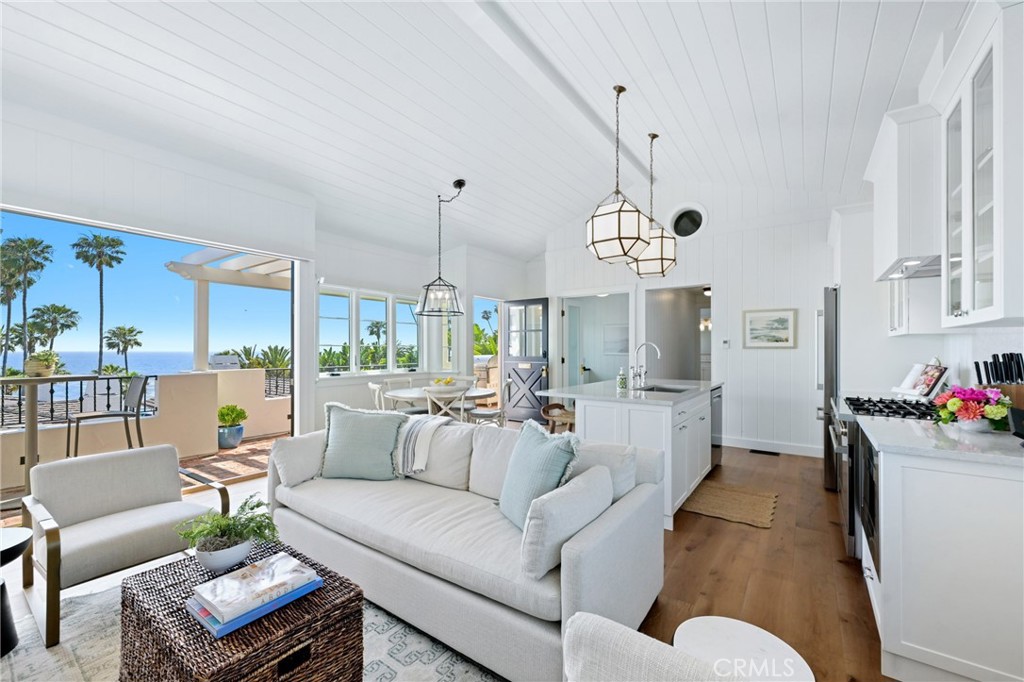 This beautifully furnished cottage is located directly on the Pacific Ocean immediately across the street from Heisler Park. The renowned park offers winding paths, beautiful flowers, crashing waves and some of the best sunsets to be found. The cottage is just steps from Main Beach, the quaint shops, restaurants and art galleries in the village, the famous tide pools and multiple coves that are perfect for reading, relaxing, swimming or just enjoying the sights and sounds of the ocean. This home offers privacy and tranquility while being refreshingly convenient to the beach, farmers market, galleries, shops and restaurants.
The 3 Bedroom 3 Bathroom home is cozy at 1528 square feet. The master bedroom and second bedrooms both have ensuite bathrooms. The third bedroom works well as a study with a built-in desk but doubles as a bedroom with a sleeper sofa and sleeping loft. Breathtaking ocean views can be found in every room and the home opens to a beautiful patio with a fire pit that is wonderful for morning coffee and evening sunsets. One garage parking space is included and Laguna’s free open air trolley stop is less than a block away so no car is necessary. Things to do locally include swimming, tennis, pickle ball, stand up paddle boarding, surfing, golfing, hiking, biking, boating, fishing, whale watching, tide pooling, shopping and dining. Within a short drive you will find Crystal Cove State Park, Laguna Coast
Wilderness Park, Newport Beach, Balboa Island, Dana Point, Huntington Beach, Historic San Juan Capistrano and Disneyland. Nearby shopping includes Fashion Island, Irvine Spectrum and South Coast Plaza. John Wayne Santa Ana Airport is only 20 minutes away.
A one-bedroom guest home can be rented separately which is perfect for family and friends to visit and share in the beauty that Laguna has to offer. Fully furnished, long-term vacation rental. 31 day minimum. Available starting September 1st for a 9-month lease term. Fully furnished. Pricing may vary slightly based on length and timing—contact agent for seasonal details.