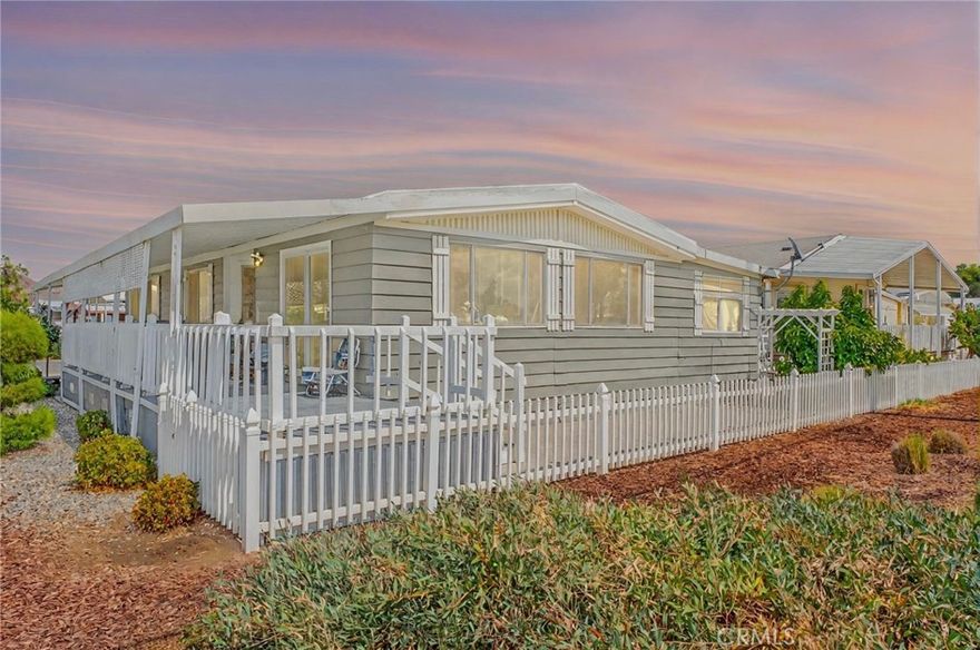 Beautiful home located in a highly desirable 55+ Manufactured Home Community. Situated on a great lot right next to the lake and golf course. This bright and open home features numerous windows that bring in plenty of natural light. The kitchen offers white cabinetry and stainless-steel appliances, with a convenient indoor laundry area nearby. Enjoy relaxing on the covered patio while taking in the scenic views. The community offers exceptional amenities including a clubhouse, swimming pool, and golf facilities—free for residents to enjoy. There are also many social events and activities throughout the year, making this an ideal place for an active senior lifestyle.