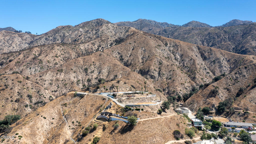 An unparalleled opportunity awaits! This expansive lot, encompassing approximately 27,565square feet, per the Los Angeles County Assessor's Office, presents a rare chance to design acustom estate or explore development possibilities in one of Altadena's most sought-afterresidential settings. Situated atop Devonwood Road, this location offers a tranquil privatesetting with unlimited potential. The former house, built in 2001, was a 2,960 square foot, fourbedroom, 3 bath modern that boasted beautiful views of the majestic mountains, the city lightstwinkling in the distance, as well as Catalina Island on a clear, crisp day!The parcel now is an idyllic blank canvas for creating a once-in-a-lifetime masterpiece, on a verydesirable site, perfect for entertaining or for placement of infinity pool! With a thoughtfullydesigned two-story build, the original panoramic vistas can be restored. All this close toFarnsworth Park, Rosebowl, and hiking trails. The opportunities abound!The lot is now being offered strictly for land value. Both Phase I and Phase II of theenvironmental cleanup and debris removal have been completed, further enhancing itsreadiness for redevelopment. Past plans can be provided. All buyers will benefit from the orderto streamline and expedite the review process, whether you use the previous renderings, orcreate your own dream home and construct a larger structure.