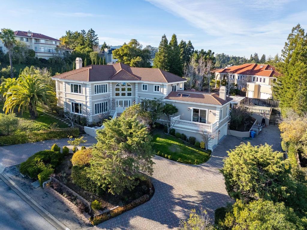 NEW LISTING AND RECENTLY REFRESHED!!! ONE OF HILLSBOROUGH'S FINEST PROPERTIES!!! Breathtaking views of the San Francisco bay & beyond. HUGE MOSTLY LEVEL LOT WITH OVER .5 ACRES. Exquisite Mediterranean designs with a red-tiled roof and circular paver driveway. A grand foyer welcomes you in with soaring ceilings. Throughout, you'll find hardwood flooring, carpeting, and recessed lighting. To the left of the foyer, a refined living room with a tasteful fireplace. On the right, a great room that integrates both the kitchen, dining area, and family room; ideal for hosting guests. The high-end, modern chef's kitchen is equipped with top-of-the-line stainless steel appliances, a large center island with quartz countertops, a wine cooler, and more! EVERY BEDROOM IS EN-SUITE with a pristine bathroom. Step outside to one of several balconies with stunning views of the San Francisco Bay, some of the best Hillsborough has to offer. The backyard features a sparkling pool and expansive lawn, with several patio sections and a BBQ area. This home encompasses luxury and practicality, with access to prestigious schools and the convenience of Highway 280. DO NOT MISS OUT, START 2025 WITH A BANG!!!