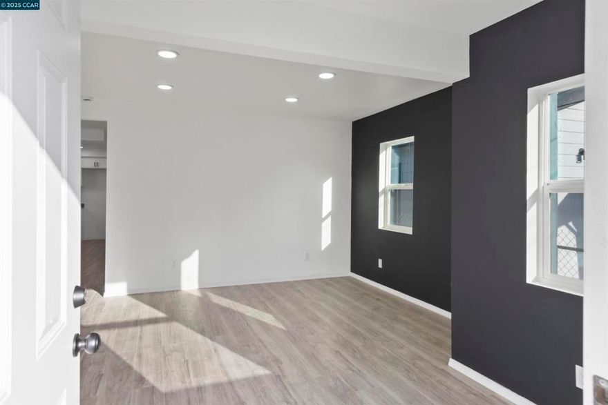 Move In Ready! Discover this fully remodeled home that seamlessly blends modern comfort with versatile living options! Close commute to main locations and freeways like Richmond Ferry, Richmond Parkway and 580 freeway. This property has been thoughtfully transformed into a spacious 3-bedroom, 1-bathroom main residence, complete with a potential in-law unit offering an additional 2 bedrooms and 1 bathroom—Step inside the main house and be greeted by brand-new laminate flooring that flows throughout, creating a warm and inviting atmosphere. The heart of the home is the fully remodeled kitchen, boasting sleek countertops, contemporary cabinetry, and state-of-the-art appliances that make cooking a delight. Stay cool during those warm days with a newly installed in-wall air conditioner, ensuring year-round comfort.The flexible in-law unit expands your possibilities endlessly. Move In Ready!