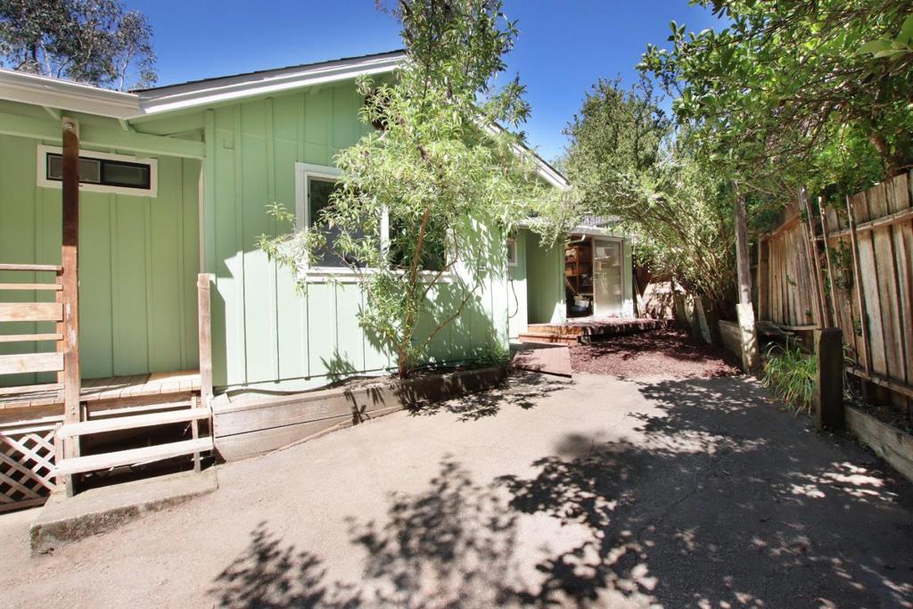 Cute, solidly built, solar powered (3.2kWh) house with an extra 280 sq. foot of laundry room, temperature-controlled wine cellar, and storage/workshop. Sunny, peaceful lot with shade in a great quiet neighborhood with hiking trails. Excellent insulation and dual-pane windows keeps it cool in hot weather and warm in cold. Freshly painted with new plush carpets and new Pergo floor in office/front bedroom. New tankless water heater, electric car charging outlet. Spacious living room with wood ceiling; kitchen has ultra quiet Bosch dishwasher, newer fridge, gas stove. Newly remodeled ensuite master bathroom with dual head shower, skylight, heater fan and a built-in exotic wood cabinet by a local wood artist. Fenced, very private yard with tree house. 30 min to beaches, 25 to Saratoga, 35-45 to Google, Facebook, Apple, Netflix, etc.