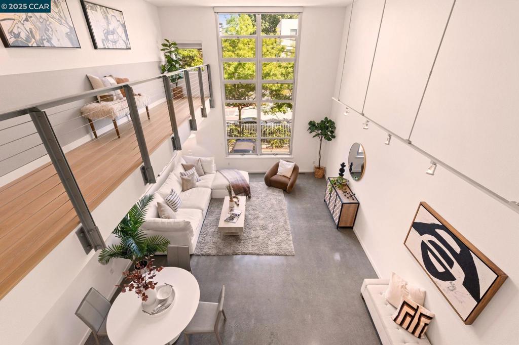 Seller to pay 50% of Buyer's HOA dues for 24 months! Plus a 2-year interest rate buy-down. This home is also eligible for up to $20,028 in credits for 1st time homebuyers. Modern, Hip Loft-style Condo with soaring 18’ ceilings and floor-to-ceiling windows providing excellent light, an expansive feeling and exceptional privacy. With over $150,000 in renovations including a Designer Kitchen, a stylish Bathroom, Walk-in Closet, new oak wood floors in the loft area, and new Paint throughout! The Bathroom boasts a bidet with heated seats, rainfall shower and an extra deep tub. The Flex Space is perfect for a home gym or office. Spacious roof-top deck with views, an elevator, a bike storage room, In-unit Laundry and ABUNDANT STORAGE! Perfect for a professional couple or for starting a family. Located on the Olone Greenway with a Walking Score of 94 and just a few blocks from the coveted Berkeley Bowl, Bay Street Shopping Center and the newly renovated Public Market with shops, modern restaurants, a Bar and entertainment. Plus, there are nearby parks for kids! A commuter's dream, with quick access to Public Transportation, express buses to SF, Amtrak, and a free shuttle to BART. Easy freeway access, a short drive to San Francisco, Berkeley and Oakland.