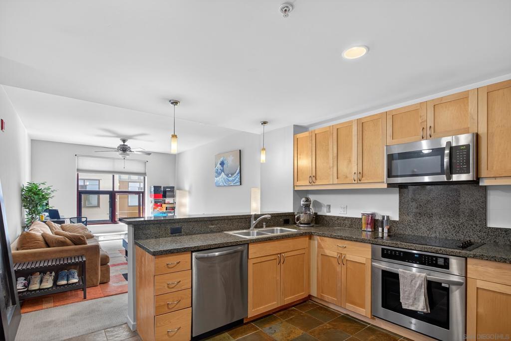 Located in the vibrant East Village neighborhood, this upgraded 1-bedroom condo at Metrome offers peaceful urban living with a courtyard-facing location—away from the busy street. This 2nd-floor unit features slate flooring in the kitchen and bath, granite countertops, stainless steel appliances, and maple cabinetry. The open layout is filled with natural light, and includes central A/C, in-unit stackable washer/dryer, and one assigned parking space. Residents enjoy access to a fitness center, community room, and secure entry. Just blocks from Petco Park, coffee shops, dining, and more. Small pet ok*
