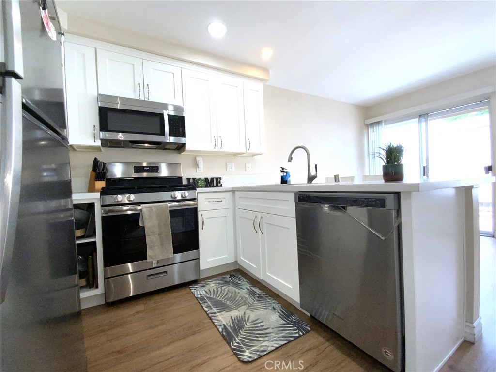 One level townhouse, 2 Bedrooms, 2 Bathrooms, highly sought-after Garden Park Community with 1118 sq/ft of living space and 2334 sq/ft lot. 2 detached car garage with 420 sq/ft. The townhouse features a family room with fireplace, kitchen and dining room, where you have access to the back patio connected with garage. Inside laundry room for two full units.