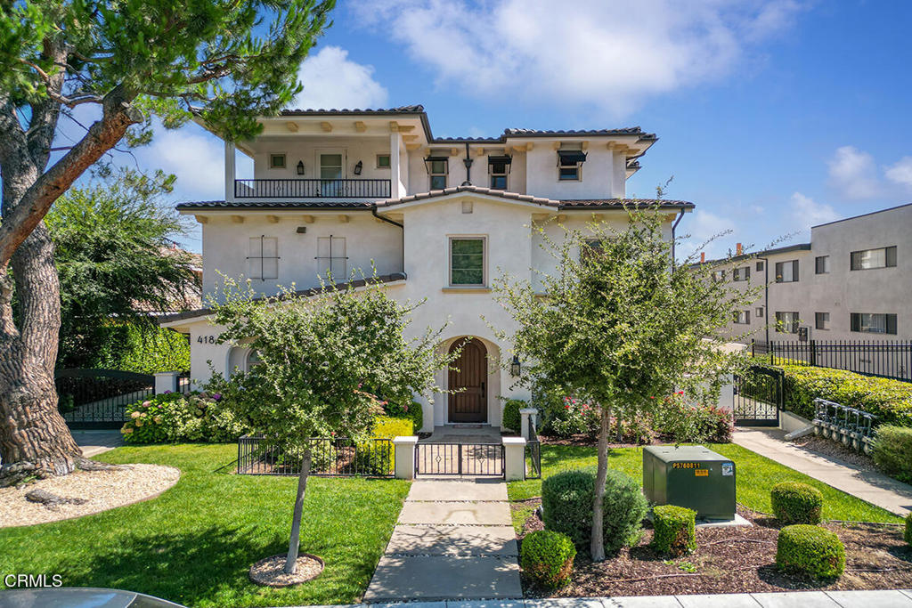 This stunning gated end-unit tri-level townhouse is located in the heart of Arcadia, tucked within an exclusive 6-unit luxury community. Offering both privacy and style, this thoughtfully designed home features 4 bedrooms, 3.5 baths, and a smart layout ideal for modern living. Behind the private gated front patio, you're welcomed into a bright and stylish foyer. Just off the entry is a generously sized en-suite bedroom with a 3/4 bath perfect for guests, in-laws, or a private gym. The attached two-car garage offers direct access along with built-in overhead storage for added convenience. The second level features an open-concept design ideal for entertaining. The spacious dining area opens to a private balcony and flows into the sleek kitchen, outfitted with high-end Bertazzoni appliances, an oversized center island, quartz countertops, and ample cabinetry. A separate living room offers a cozy space to gather, while a powder bathroom and a tucked-away laundry closet add everyday convenience. Upstairs, the third level is dedicated to rest and retreat. The luxurious primary suite boasts a custom walk-in closet and a spa-inspired bath with dual vanities, a soaking tub, walk-in shower, and a solar tube that brings in soft natural light. Two additional bedrooms and a shared full bathroom complete this floor. As an end unit, the home enjoys abundant natural light and enhanced privacy throughout. Smart-home features include keyless entry, smart switches, Google Nest thermostat, smart washer/dryer, wired media panel, Graber blinds, a tankless water heater, and a whole-home water softener system. HOA dues: $306.20 + water. Centrally located near top-rated Arcadia schools, The Shops at Santa Anita, Santa Anita Park, restaurants, markets, and the Gold Line station, this home offers a rare blend of luxury, location, and lifestyle. Don't miss your opportunity to live in one of the most desirable pockets of Arcadia!