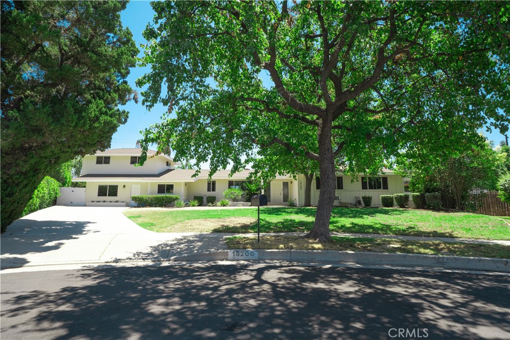 Tennis Court Estate on a Prime Cul-de-Sac!
Tucked away on a peaceful cul-de-sac, this light-filled and beautifully maintained estate offers the perfect blend of comfort, functionality, and lifestyle. With nearly 3,000 square feet of living space, this expansive 6-bedroom, 3-bathroom home is ideal for multi-generational living or added privacy. The main level features 4 generously sized bedrooms and 2 bathrooms, while the upper level includes a private 2-bedroom, 1-bath suite with its own entrance—perfect for guests, extended family, or potential rental use.
Inside, you'll find an elegant living room, formal dining area, and a bright eat-in kitchen framed by a picture window that fills the space with natural light. A dedicated laundry room and abundant storage throughout the home provide everyday convenience, while a versatile bonus room offers flexible use as a home office, gym, or creative studio.
The primary suite is a peaceful retreat, showcasing a beautifully updated en-suite bathroom with modern finishes. Thoughtful upgrades throughout include copper plumbing, dual-pane tinted windows for energy efficiency and privacy, two separate HVAC systems for year-round comfort, and a comprehensive security system for added peace of mind.
Outdoors, enjoy the luxury of your own private tennis court, surrounded by mature landscaping and the tranquility of a cul-de-sac setting. Ideally located just minutes from shopping, dining, major freeways, and CSUN, this is a rare opportunity to own a spacious and well-appointed home in one of Northridge’s most desirable neighborhoods.