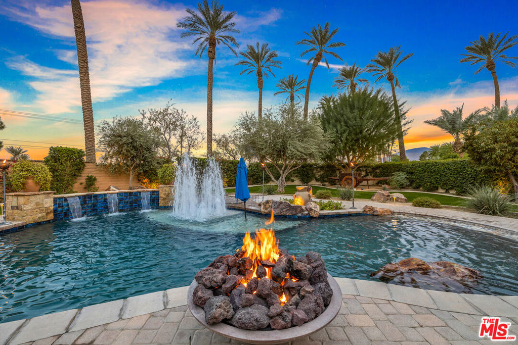 Resort style living home at The Palms, world famous golf course in a beautiful, guard gated community nestled in La Quinta. Updated & newly furnished 3+3. Open floor plan home with separate entrance casita. Situated on nearly 1/2 an acre complete with beach entry pool, separate hot tub, built in BBQ & seating area, 5 hole putting green and sand trap. Spectacular lit up yard makes for magical evenings in the desert. Chef's kitchen with island. Master suite has double vanities, updated walk in shower, soaking tub and large walk in closet. Attached 2 car garage + golf cart garage. 2 bedrooms and 2 full baths in the house, 1 bedroom and 1 full bath in the casita. Ready to enjoy for the season, call your agent for monthly pricing. PGA West Golf Courses just around the corner. Min 30 day rental, call for summer and in-season rates