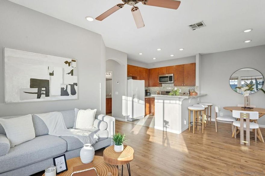 Refreshed and move-in ready! This END UNIT townhome in Ivy Hill at Scripps Ranch Villages features vaulted ceilings, engineered hardwood floors, and an updated kitchen with granite counters, warm wood cabinets, and a breakfast bar. Enjoy a private balcony, refreshed baths with granite counters, and a primary suite with updated walk-in shower and walk-in closet. Additional perks include brand new A/C, newer water heater (2024), ceiling fans, attached 2-car garage with washer/dryer. Community offers pool, spa, and playground in a prime Scripps Ranch location., close to shopping and restaurants.