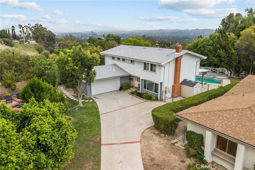 This updated 5-bedroom, 3-bath, 2,470 sq. ft. West Hills home is ideal for professionals seeking both convenience and lifestyle. Featuring new paint, flooring, and kitchen appliances, the residence offers modern comfort in a quiet hillside setting with sweeping views. Enjoy a backyard retreat complete with pool, mature landscaping, and wildlife. The home is minutes from major freeways, Ventura Boulevard, and employment centers, and just a few short miles from Malibu via scenic canyon routes. Fully paid solar provides energy savings, and the location offers quick access to Calabasas, Woodland Hills, and West L.A.