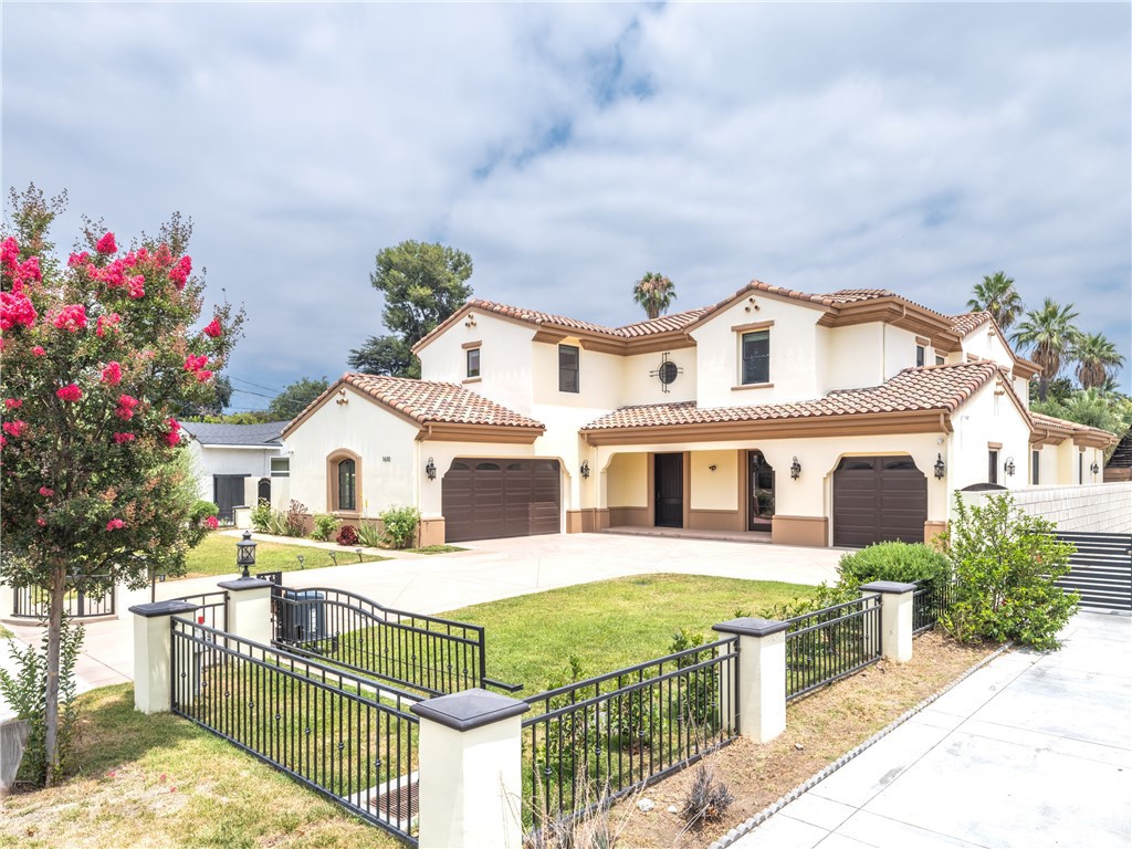 Situated in Arcadia’s desirable Mayflower Village, this elegant Mediterranean-style home sits behind its own automated front gate, offering both privacy and curb appeal. The layout features 6 en-suite bedrooms and a powder room, with two suites on the main level—one ideal for guests or extended family, and the other perfectly suited for use as a home office or study.
A soaring two-story foyer opens to formal living and dining rooms, while the main kitchen includes a center island, walk-in pantry, breakfast area, and a separate wok kitchen for added flexibility. The family room with wet bar and wine fridge connects seamlessly to a covered patio and lush backyard, creating the perfect space for indoor-outdoor living. Additional highlights include a private home theater, an upstairs loft, and a luxurious primary suite with a private balcony offering beautiful mountain views, a sitting area, spa bath, and walk-in closet. A 3-car garage and well-planned layout make this home as functional as it is beautiful.