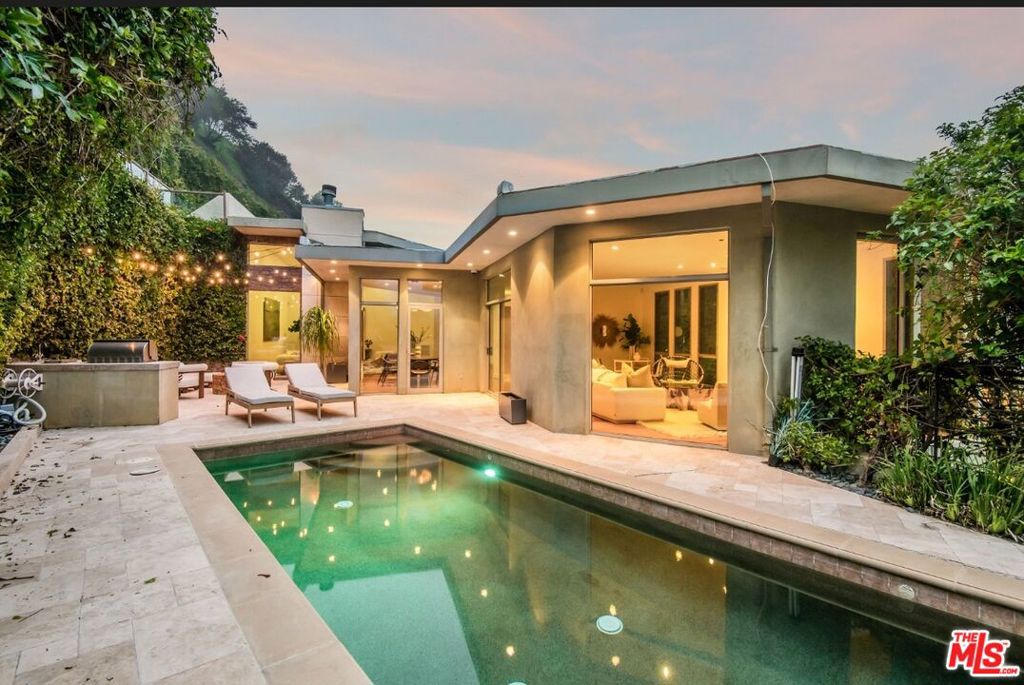 Fabulous Lease in Prime Brentwood! Tucked away in one of Los Angeles' most prestigious canyon enclaves, this refined residence combines luxury, privacy, and a connection to nature. Framed by sweeping canyon views, the 4 bedroom 5 bath home features all-ensuite bedrooms, an inviting family room, and seamless indoor-outdoor flow to a stone patio, pool, and spa. Perfect for both relaxation and entertaining, the property offers a two-car garage and direct access to exclusive hiking trails. Move-in readyjust bring your toothbrush.