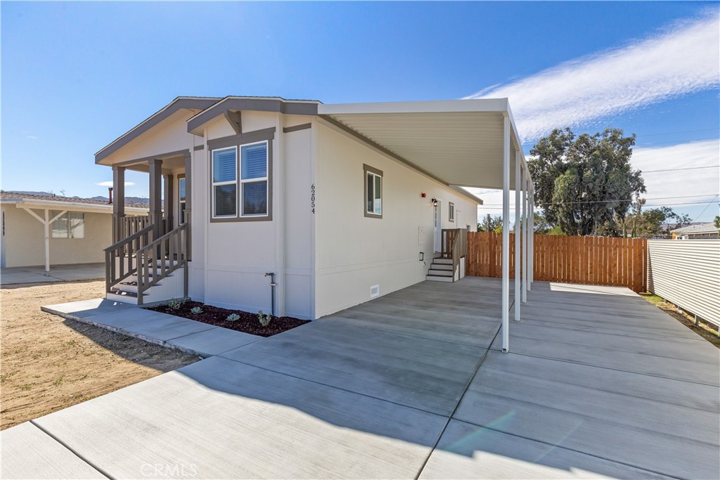 Welcome Home! Brand New 3 Bed, 2 Bath Home in Joshua Tree!
This 1,295 sq ft manufactured home features a beautiful open floor plan, large indoor laundry room, and all-new energy-efficient appliances—including stove/oven combo, microwave, dishwasher, refrigerator and A/C. Located on a 433a permanent foundation, it's FHA/VA approved and comes with a 12-month transferable factory warranty. Enjoy a low-maintenance, fully fenced backyard, brand-new concrete driveway, and covered parking for two. Room for future upgrades like a shed or garage. Stunning mountain views and move-in ready!