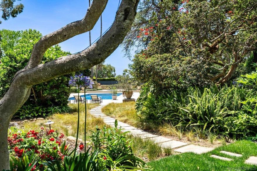 ***PROPERTY WILL BE RE-LISTED SHORTLY. PLEASE DO NOT CONTACT OWNERS, THEY ARE ON THE DO NOT CALL REGISTRY.*** A Life So Rare, It Can Only Be Lived Here.  Welcome to The Muir Garden Estate—where history whispers through century-old trees, ocean breezes drift across sunlit verandas, and every moment feels touched by magic. This is more than a home; it is a world of its own. A private, botanical sanctuary overlooking the Pacific, curated by Kate Sessions herself, designed to nurture connection, celebration, creativity, reflection, and joy. Here, lifestyle isn’t imagined—it’s lived. Wake to the sound of birdsong drifting through 2.65 acres of gardens that feel lifted from Balboa Park. Wander down stone paths lined with rare, mature plantings—landscapes that took nearly a century to grow and that money simply cannot replicate. Ease into your morning on one of many ocean-view verandas, coffee in hand, watching the coastline glow as the sun rises over your private estate. Every viewpoint offers a different mood, a different chapter of your day. Host unforgettable gatherings—from sunset dinner parties in the grand formal dining room to intimate cocktails in the billiard lounge, movies in your private Hollywood theater, or friendly matches on your regulation tennis court. Live well, live beautifully. A resort-inspired saltwater pool invites long, warm afternoons. The koi pond adds serenity. The spa and redwood sauna offer a personal retreat. The gym, golf simulator, and game room bring activity, play, and wellness into daily life.  26 Reasons Why The Muir Garden Estate Is Unlike Anything Else on the Market Architectural Heritage  1) Designed by the esteemed Edgar Ulrich, this authentic Santa Barbara estate holds coveted Mills Act designation for historical significance.  2) Thoughtful Modernization Meticulously expanded and upgraded by the current owner in collaboration with Island Architects—preserving charm while enhancing livability.  3) Enchanting Grounds 2.65 acres of Balboa Park–inspired gardens, masterfully curated by Kate Sessions, the “Mother of Balboa Park.”  4) Panoramic Ocean Views Sweeping, uninterrupted vistas of the Pacific and California coastline.  5) Resort-Style Amenities Enjoy a private saltwater pool, spa, koi pond, and a luxurious cabana with full kitchen and bath.  6) Regulation Tennis Court Ideal for both competitive play and leisurely matches.  7) Chef’s Kitchen Equipped with top-tier appliances and designed for culinary excellence.  8) Formal Sitting Room An elegant space for refined entertaining or quiet reflection.  9) Music Room & Study Tailored for creativity, focus, and inspiration.  10) Billiard & Bar Lounge Entertain in style with classic games and cocktails.  11) Hollywood-Style Theater Your personal cinema with immersive surround sound and plush seating.  12) Game Room & Golf Simulator The ultimate indoor retreat, blending fun with sophistication.  13)Grand Dining Room Host unforgettable dinners in a dramatic, showstopping setting.  14) Luxurious Owner’s Suite A private sanctuary with dual spa-inspired bathrooms and generous walk-in closets.  15) Private Gym & Redwood Sauna Wellness and relaxation meet in your own fitness haven.  16) En-Suite Bedrooms Spacious guest rooms, each with their own beautifully appointed bathroom.  17) Charming Bunk Room Perfect for children’s adventures or sleepovers.  18) Expansive Family Room A warm, inviting space for everyday living and memory-making.  19) Multiple Verandas Take in ocean breezes and garden views from a variety of peaceful outdoor living areas.  20) Detached Guest Suites Two serene guest residences—one with 2 beds/1 bath, the other with 1 bed/1 bath—ideal for visitors or multigenerational living.  21) Irreplaceable Landscaping The mature, priceless gardens are a living work of art, planted by the legendary Kate Sessions herself.  22) Six-Car Garage Plenty of room for car enthusiasts, collectors, and guests.  23) Gated Compound Enhanced privacy and pea...