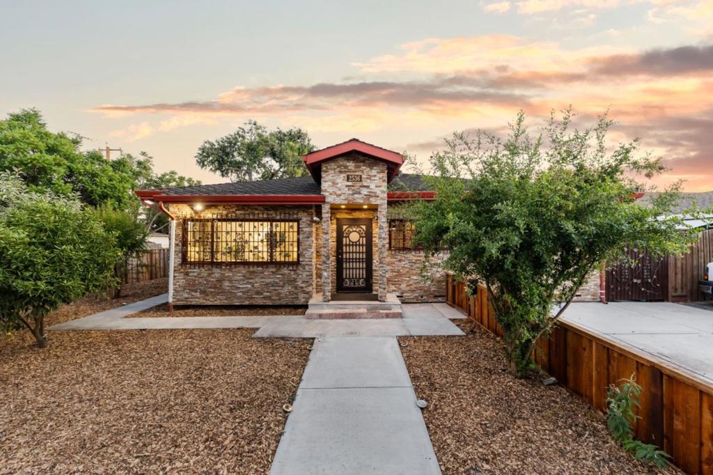 A spectacularly built 2015 custom home welcomes you in the vibrant city of Santa Clara, featuring four bedrooms and three bathrooms, with amenities such as a Custom Copper Tub with Jets and Newer shower Panel Tower System in the primary suites, copper pedestal sink, urinal and granite stand alone tub, granite bathroom walls and Muralime plaster ceilings providing a spa-like experience. This kosher kitchen with a standout features like a Custom Copper Hood over-range, double ovens, two sinks side by side, newer refrigerator and double door panty is designed for both functionality and style, ideal for culinary enthusiasts The home includes a formal dining area perfect for evening gatherings. The wood flooring throughout the house, Travertine kitchen flooring, granite bathroom flooring and custom doors throughout the home complements the overall aesthetic and promises durability and easy maintenance. The property on a corner lot features two driveways, an automatic metal gated side yard offers secured parking plus a two-car garage and a shed in the backyard for storage. Located within the Santa Clara Unified School District, Enjoy living in a dynamic community with easy access to local amenities and attractions. You don't want to miss to make this home your new home.