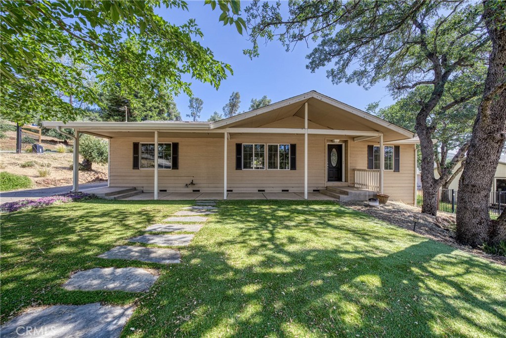 Located in a quiet culdesac this like new 3 bedroom 2 bath home on .33 acres located in the gated community of Hidden Valley Lake. The home features new carpeting throughout, granite countertops along with a chefs kitchen, stainless steel appliances, walk in pantry and butcher block island makes it perfect for entertaining. The private back patio extends from the detached garage, offering a secluded outdoor retreat. Enclosed by a fully fenced yard, this space features a two-car garage and a remote-controlled, solar-powered entry gate for easy access. Hidden Valley Lake subdivision includes many amenities such as a beautiful lake with multiple beaches as well as a boat launch, competition sized pool, eighteen-hole championship golf course, horse stables, dog park, tennis courts, restaurant/lounge, and nearby shopping and so much more! Only 30 minutes from Calistoga and lovely Napa Valley Wine country and 40 miles from Santa Rosa. Just a short drive to some of the most amazing local wineries and restaurants Lake County has to offer.