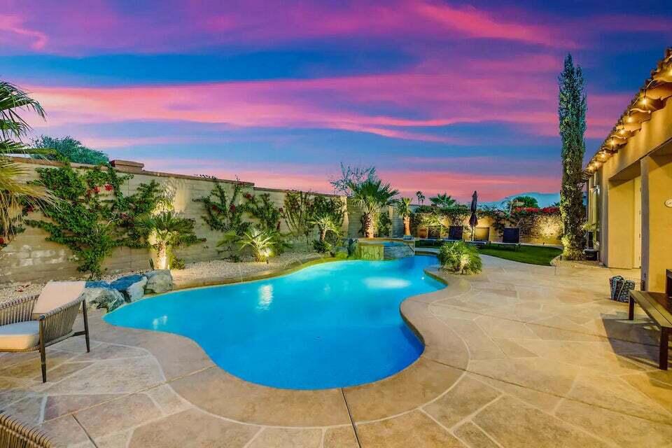 Investor's Dream Meets Resort-Style Living in Montage at Santa RosaDiscover the perfect fusion of luxury, flexibility, and proven income potential with this turnkey 5-bedroom, 4-bathroom estate in the exclusive Montage at Santa Rosa. Featured in Sunset Magazine and fully approved for short-term rentals, this high-performing property is the ideal asset for investors seeking exceptional ROI.Boasting major recent upgrades--like brand-new quartz countertops, fresh interior paint, and custom stamped concrete in the courtyard and backyard--this home is meticulously curated for modern comfort and elevated design. The garage has been expertly transformed into a sleek game room, and a newly installed EV charger adds even more market appeal.Step outside to your private oasis: a heated saltwater pool with tanning shelf, elevated spa, fire pit, granite slab bar with seating for five, and a putting green--all designed to wow guests and attract premium nightly rates. The attached casita with private entry offers added privacy and rental versatility.Inside, you'll find a thoughtfully designed floor plan with dual living areas, multiple dining zones, and three bar seating areas--perfect for entertaining large groups or creating memorable guest experiences.Just minutes from Empire Polo Club (home to Coachella and Stagecoach), this home is perfectly positioned to capitalize on the region's thriving short-term rental market.Whether you're building your investment portfolio or seeking a luxurious desert retreat with serious earning potential--this is the one.