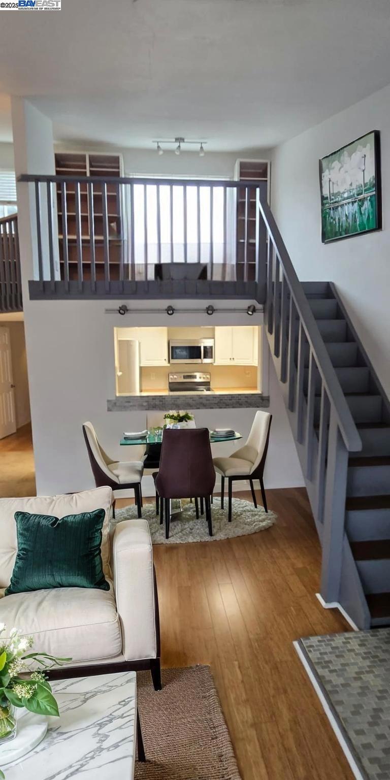 CHIC + LOVELY Leona Heights townhome-style condo featuring a SPACIOUS + FUNCTIONAL floor plan with 2 bedrooms and 2 full bathrooms PLUS a ZOOM ROOM LOFT home office! All new double-paned windows. Beautiful NEW bamboo hardwood floors throughout. High vaulted ceilings in sunny and bright living/dining room with cozy fireplace. PLUS there's a cool upper loft office/den space with ample storage room. Delightful kitchen with butcher block counters, new GE fridge and stainless steel appliances. Bedrooms with built-in closet components. Easy in-unit LG laundry machines. New paint and light fixtures. Convenient and close to Lincoln Square, Redwood Heights, Woodminster, Montclair Village, Laurel and Dimond Districts for plenty of grocery stores, shops and restaurants. Outdoor recreation with nature parks, hiking/biking trails, fly-fishing pond and close to Mills College, the Oakland Zoo and Chabot Space and Science Center in the Oakland Hills! Make this your next new HOME, SWEET HOME!!!