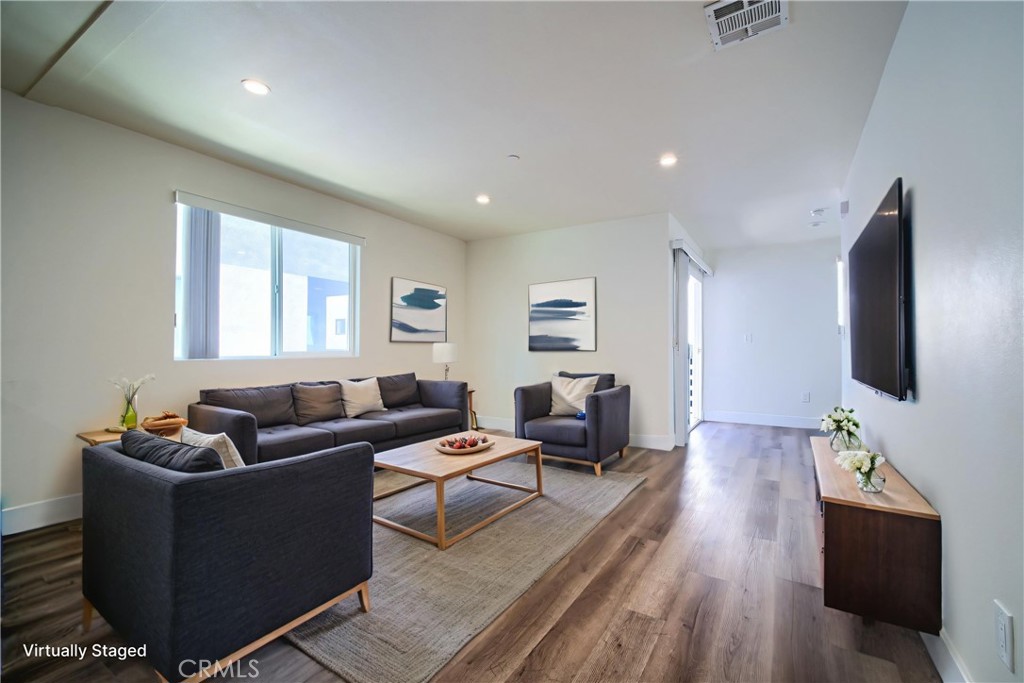 Welcome to 1425 S New Hampshire Ave, a spacious and modern 5-bedroom, 4-bathroom rear-unit townhome built in 2021 with an attached garage, ideally located in the heart of Koreatown. This three-level residence features a thoughtfully designed floor plan that blends comfort with functionality. The first floor offers a private attached garage plus an additional assigned parking space, along with a generous en-suite bedroom and oversized closet. On the second floor, an open-concept living, dining, and kitchen area creates the perfect setting for entertaining. The modern kitchen includes stainless steel appliances—refrigerator, stove, dishwasher, and overhead microwave—and opens directly to a large balcony that extends the living space. A second bedroom and full bathroom are also located on this level. The third floor hosts three additional bedrooms and two bathrooms, including another en-suite, along with a stacked washer and dryer for ultimate convenience. Additional features include central HVAC, solar, and ample storage throughout.
Enjoy the best of city living with a peaceful residential feel. This home is just minutes from Downtown LA, Hollywood, and Beverly Grove, with Koreatown’s renowned dining scene right outside your door. Local favorites such as Quarters BBQ, BCD Tofu House, and Kang Ho-Dong Baekjeong are just blocks away, along with The Wiltern Theater, cafes, bars, and nightlife. For commuters, the property is ideally situated near the Metro Red and Purple Lines, major bus routes, and offers easy access to the 10 and 101 freeways. Popular attractions like LA Live, Staples Center, Griffith Park, and Echo Park Lake are close by, and the USC campus is only 1.45 miles away.
With its unbeatable combination of space, style, and location, 1425 S New Hampshire Ave is an exceptional choice for those seeking modern amenities in a vibrant neighborhood. All utilities are separately metered and the tenant is responsible.