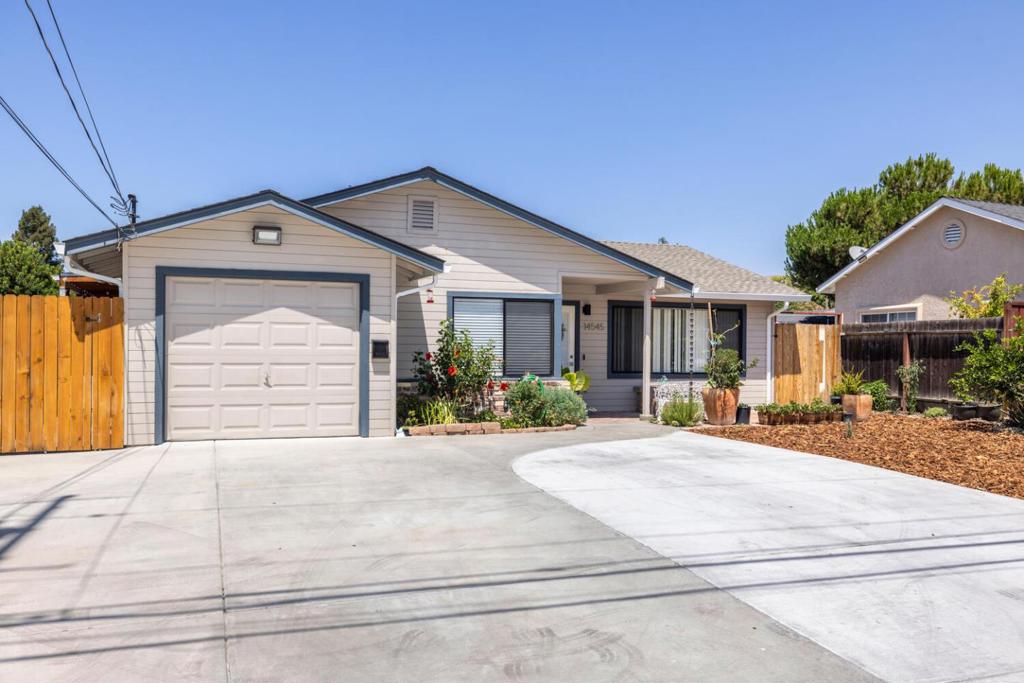 Don't miss this opportunity to own a charming, move-in-ready 3-bedroom home in the heart of Alum Rock. This house has been thoughtfully updated with significant improvements, including a newer roof, heater, A/C, and a tankless water heater, providing you with peace of mind for years to come. Step inside to a bright and spacious living room that creates a welcoming atmosphere. The kitchen is a true standout, featuring high-quality, soft-close cabinets with convenient roll-out drawers, quartzite countertops, and a full suite of stainless steel KitchenAid appliances. The renovated bathroom boasts a stall shower, custom cabinetry, and brushed nickel fixtures. You'll find ample storage throughout the home, including a custom built cabinet and drawers in the hallway. Outside, a low-maintenance front yard and a covered porch offer a perfect spot for relaxing. The backyard is a fantastic bonus, featuring a newer fence and a dedicated 18x20 metal workshop with a 220/120 volt electrical panelideal for hobbies, projects, or extra storage. This home is a perfect blend of comfort and functionality.