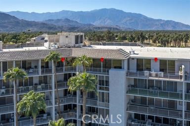 Desert Island Designer Penthouse. This exceptional home has picturesque Mountain, Lake, and Golf course views. Located minutes from shopping on El Paseo Drive. Beautifully designed penthouse with customized upgrades i.e., Porcelain tile flooring, custom recessed lighting, custom fixtures, and bathrooms have Quartz counters. State-of-the-art appliances and fixtures throughout. Remote-controlled fireplace with Terra Cotta herringbone brick and limestone.