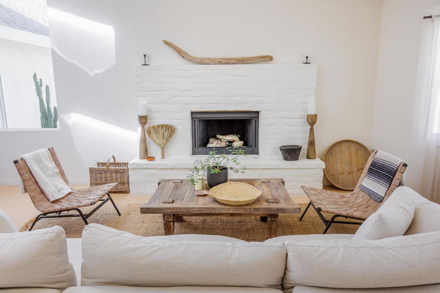 Tucked back from the road just enough, this thoughtfully updated and peaceful Joshua Tree retreat offers a perfect balance of privacy and style. Featuring beautifully finished concrete floors, an open-concept living space, a well-appointed kitchen with large island, and a sun-filled living room with soaring ceilings, skylight, and brick fireplace. The primary bedroom suite is a true retreat, complete with a large soaking tub and striking walk-in shower. Two spacious guest bedrooms and beautiful baths offer plenty of space for visitors to relax and unwind. Attention to detail shines throughout the design of this home, which presents a cohesive and inviting aesthetic. Spanning two lots totaling 2.33 acres (additional APN included in sale) and boasting a sundeck with jacuzzi, refreshing stock-tank pool, mature shade trees, and a detached 2-car garage, this property provides ample space and privacy for all of your indoor and outdoor activities. Take in the sunrise and mountain views from the front porch swings, and enjoy sunsets and stargazing around the fire in the private backyard. Currently operating as a popular short-term rental, this home is an ideal opportunity for a full-time residence, second home, or investment property.