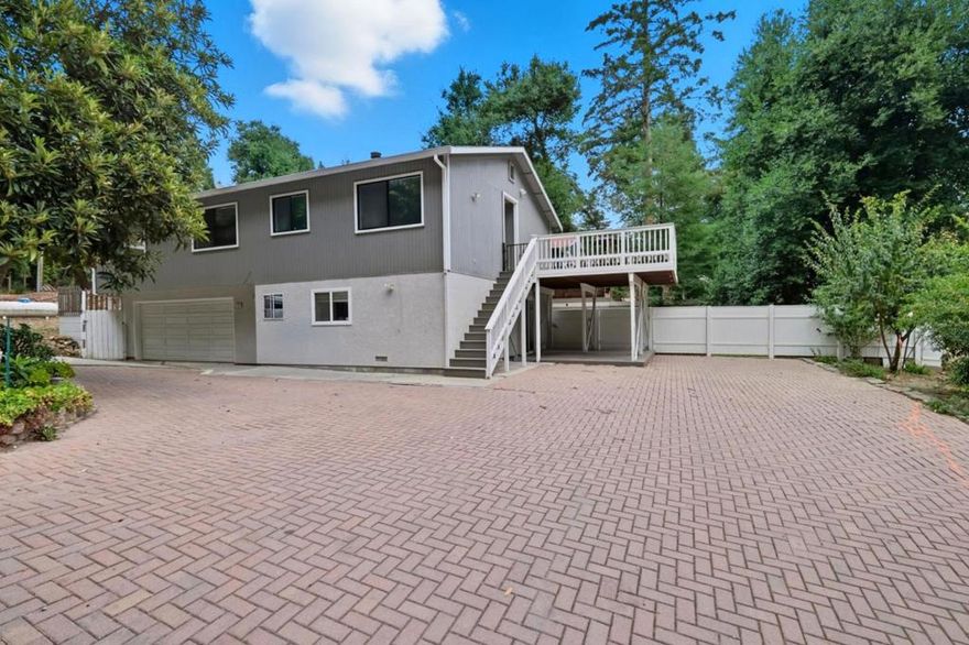 Welcome home! Your serene retreat awaits, nestled in the heart of the picturesque Redwood Estates, where tranquility meets convenience. This inviting home is perfectly located on a sunny, generous flat lot, offering both privacy and an idyllic setting for a peaceful lifestyle. Minutes from vibrant downtown Los Gatos, this home has easy access to top-rated schools, making it THE choice for those seeking both seclusion and connection.  Step inside and be captivated by the open living room and 3 spacious bedrooms. Warm and welcoming ambiance flows seamlessly from room to room. The downstairs ~482 sq ft 1/1 unit  offers great full living opportunity.  Step onto a generous deck that beckons you to relax, or head out to the large flat backyard, and be surrounded by mature trees. Perfect for morning coffees, mellow afternoons, or entertaining guests under a starry sky.  Embrace true community living with access to exceptional amenities including a sparkling pool, two playgrounds, and a vibrant community center. Ample opportunity for recreation and social engagement, enhancing the draw of this charming neighborhood. Have peace of mind with the nearby fire station, a reassuring layer of security, allowing you to fully enjoy the serene mountain lifestyle that Redwood Estates is known for.