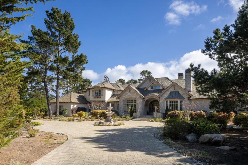As the entry gates open, a grand estate presents itself. This spectacular, 4 bedroom, 6 bathroom manor, together with its 2 bedroom detached caretakers cottage is the ultimate getaway for creating endless memories with family and friends. The expansive ground floor primary suite has an extra office and an oversized walk-in closet. The spacious kitchen with an adjoining family room is the perfect setting to enjoy your morning cup of coffee or wind down at the end of the day. Complete with a theater room, gym, wine cellar, and tranquil outdoor living space with a fireplace, in-ground spa, a private putting green, and available fully furnished, this home has it all. Perfectly nestled in this coveted location, youre just steps from The Lodge, The Hay, and world-renowned Pebble Beach golf courses. This extraordinary estate is also an extraordinary opportunity.
