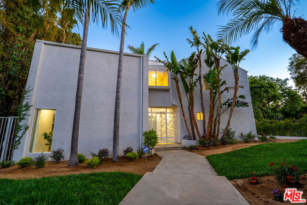 A distinctive architectural gem nestled in the heart of Walnut Acres, one of Woodland Hills' most coveted and character-rich neighborhoods. Designed by acclaimed Los Angeles architect Mark Bielski, known for his modernist vision and emphasis on scale, light, and livable form, this residence is a rare blend of artistry and function.Spanning approximately 3,047 square feet, this 5 bedroom, 5 bathroom home captures Bielski's signature aesthetic, featuring vaulted ceilings, expansive walls of glass, and a seamless indoor, outdoor flow that defines elevated California living. Built in 1988, the home's bold, yet timeless lines, thoughtful layout, and striking architectural details set it apart from the ordinary.Inside, you'll find spacious living and dining areas, a beautifully appointed kitchen, and an abundance of natural light throughout. Outside, the 9,583 square foot lot offers privacy, lush space for entertaining, and multiple areas to unwind under the sun or stars. Additional features include a 3 car garage, dedicated RV parking, and ample driveway space, making this home as functional as it is sophisticated.Located in Walnut Acres, an area celebrated for its large lots, equestrian zoning, and strong community roots, this home also offers proximity to award winning schools, Westfield Topanga, The Village, Topanga Social, fine dining, and the Los Angeles Rams practice facility.Seller is offering a credit toward buyer's interest rate buy down, an excellent opportunity to secure long term savings in today's market.