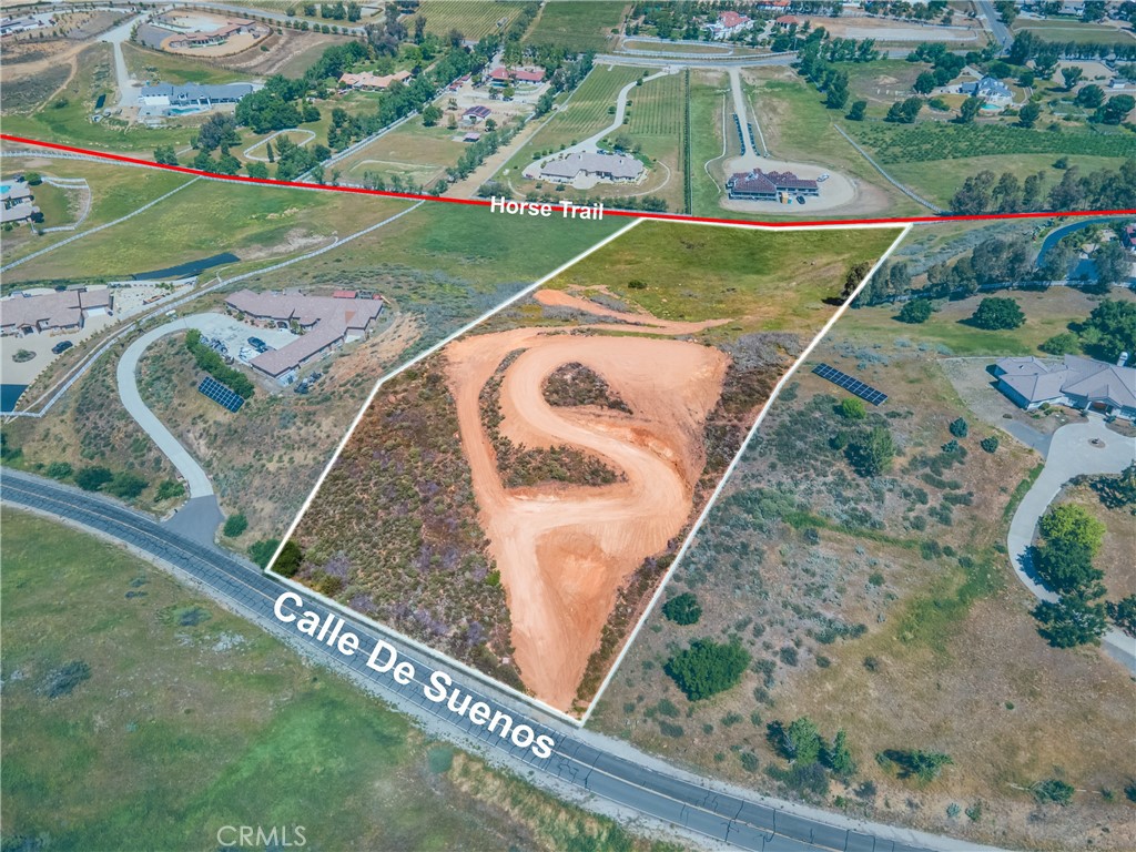 Exceptional 5-acre parcel located in La Cresta proper on the coveted Street of Dreams - Calle De Sueños. Situated between two existing custom estates (39785 Calle De Suenos with 4,684 sq ft, and 39575 Calle De Suenos with 3,853 sq ft), this is an ideal site for your custom dream home. A fantastic opportunity for builders and investors alike.
The property begins with a drive up off a quiet, paved road and is already roughly graded for access to the upper portion of the lot, where sweeping views span the valley and surrounding mountains. This elevated pad is perfect for a main residence designed to capture the natural beauty and light of the Santa Rosa Plateau.
A gradual slope leads to a peaceful, flatter section at the back of the lot with direct access to one of the La Cresta's popular horse trails. This lower area offers excellent potential for a guest house, barn, or private retreat with room for gardens or paddocks.
La Cresta is an amazing equestrian community of nature loving homeowners who take pride in their community, love the outdoors, the star filled skies and their neighbors. La Cresta has many fun community events and gatherings for those looking to socialize and miles and miles of incredible hiking and riding trails when it’s time for less socializing. Adjacent to the 9,000 acre Santa Rosa Plateau Ecological Reserve and the Cleveland National Forest, La Cresta and the other communities of the Santa Rosa Plateau consist primarily of 5+ acre parcels. The perfect place for those seeking the country lifestyle with privacy, peace and quiet, big skies and breathtaking views. All without sacrificing proximity to all the major conveniences, freeways and support facilities just a short distance away.
Come walk the land and experience the possibilities!